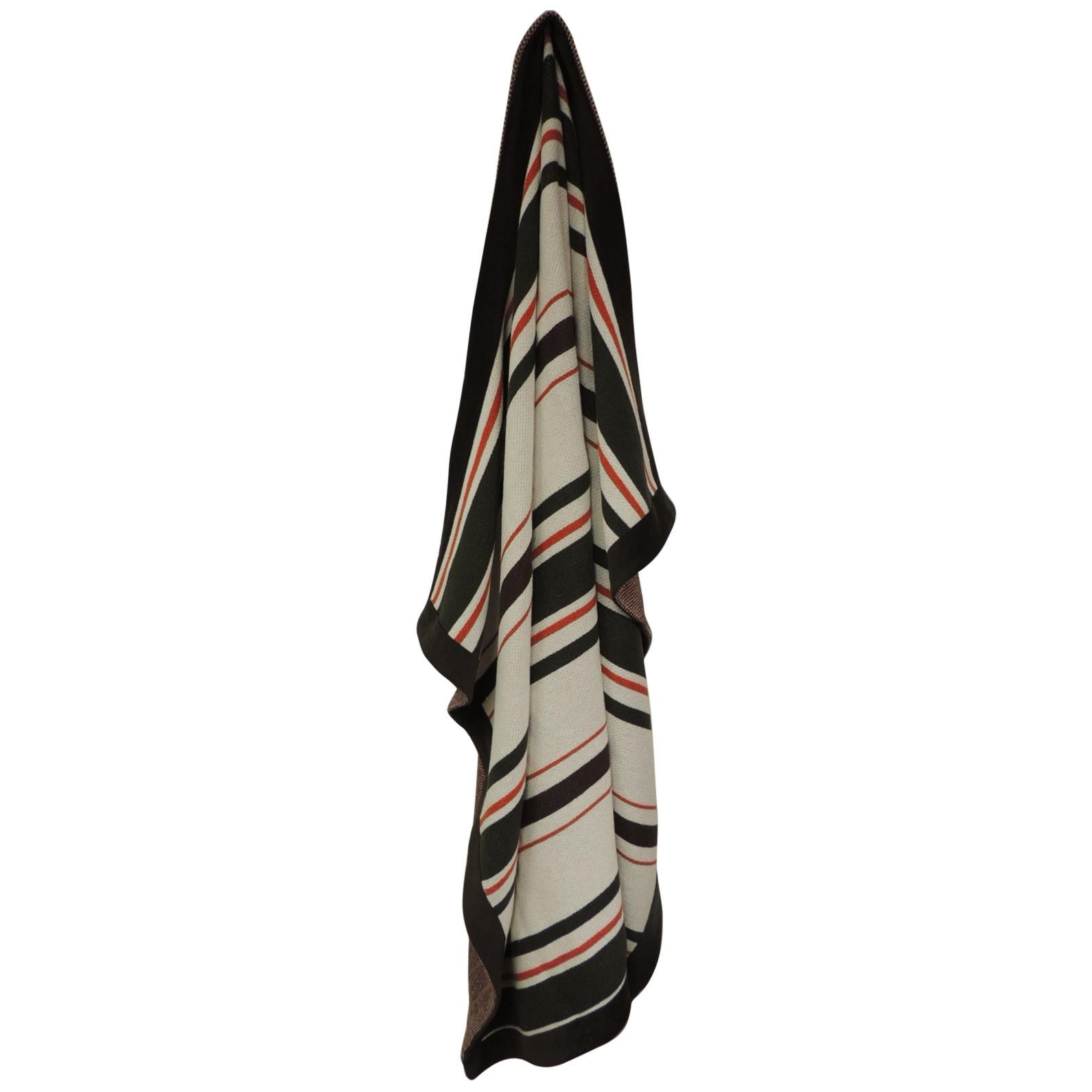Large brown and orange stripes Alessandra Branca throw with faux suede trim all
around and reversible red, brown and white tweet woven fabric.
Large, heavy throw/blanket.
Size: 66