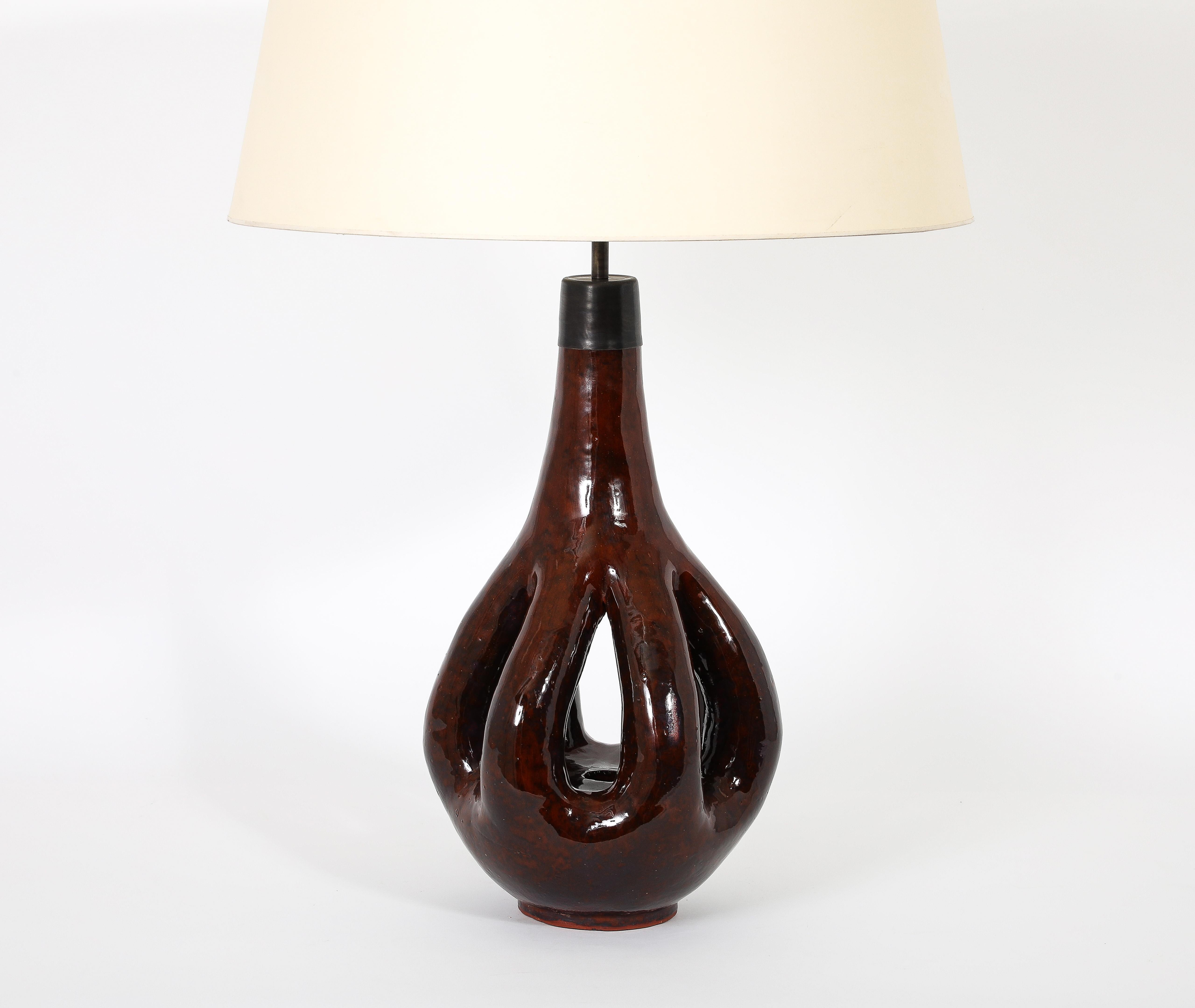 Large Ceramic lamp, an interesting organic design with a deep brown glaze.
Bronze hardware.

Base only 11x23