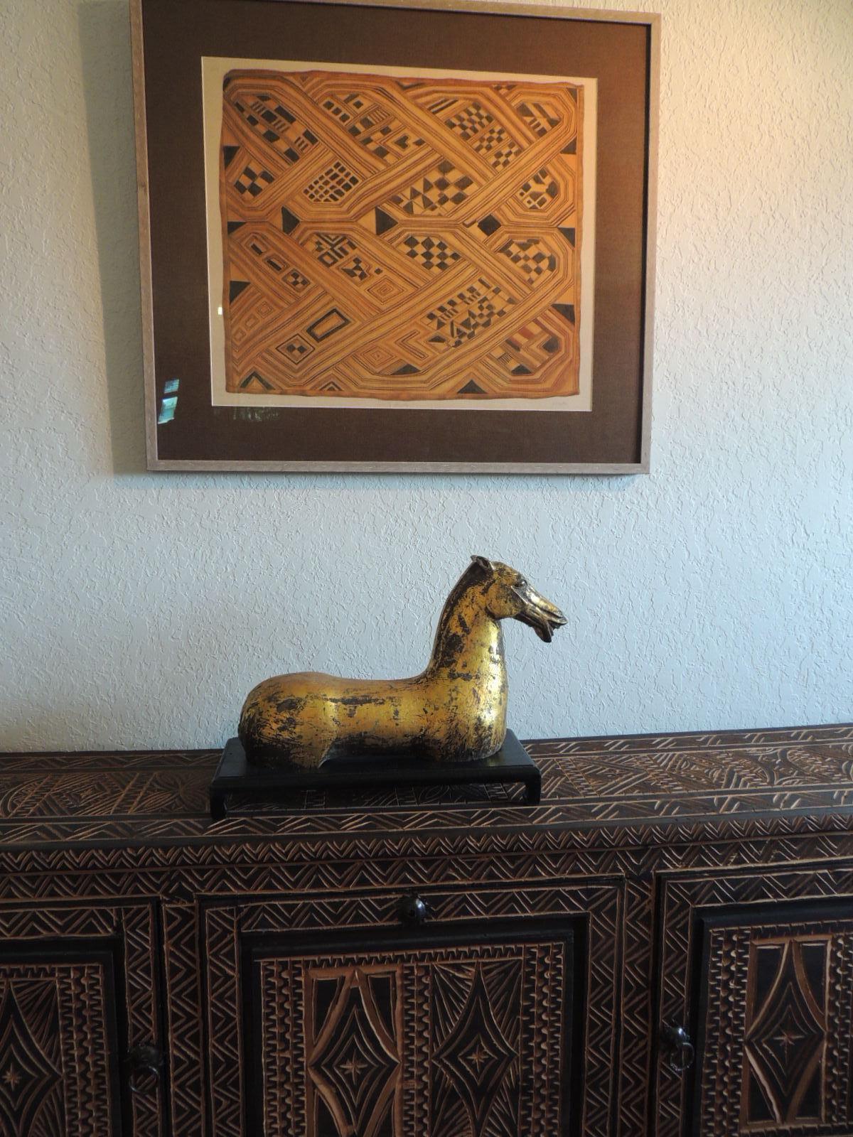 Large hand-carved tribal pattern wood long credenza, sideboard, buffet, cabinet, blanket chest, 
Brown and natural wood color cabinet from Morocco with two doors and removable shelf inside.
Middle door opens down. ‘No key’ with shelf inside. The