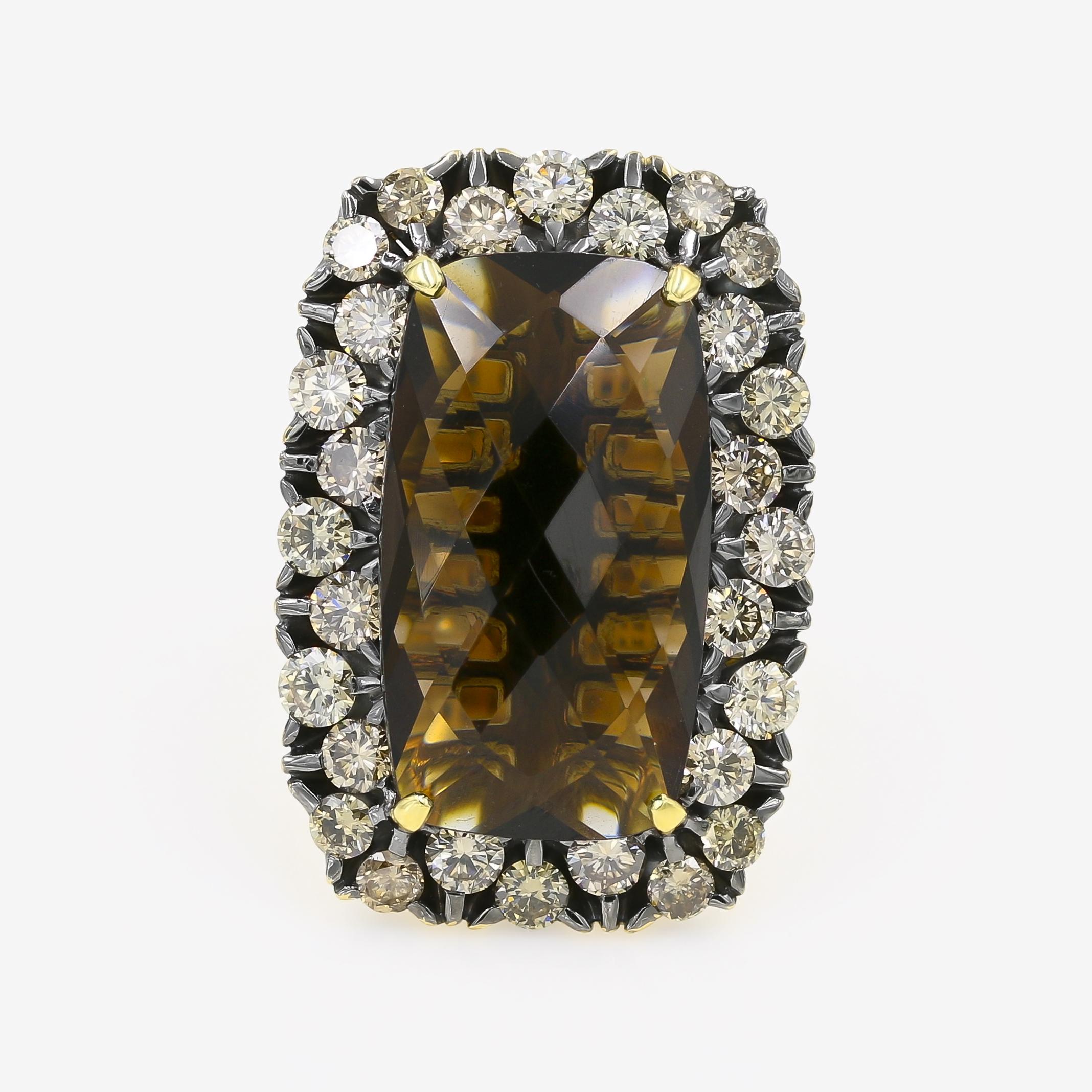 This 18kt. yellow gold ring has a rich brown rectangular faceted top smoky quartz center that is 16.00cts. Surrounding the center are 28 round brown diamonds=3.47cts. t.w. Ring is made by Garavelli of Italy.

Finger size is a 7 1/4, but can be sized