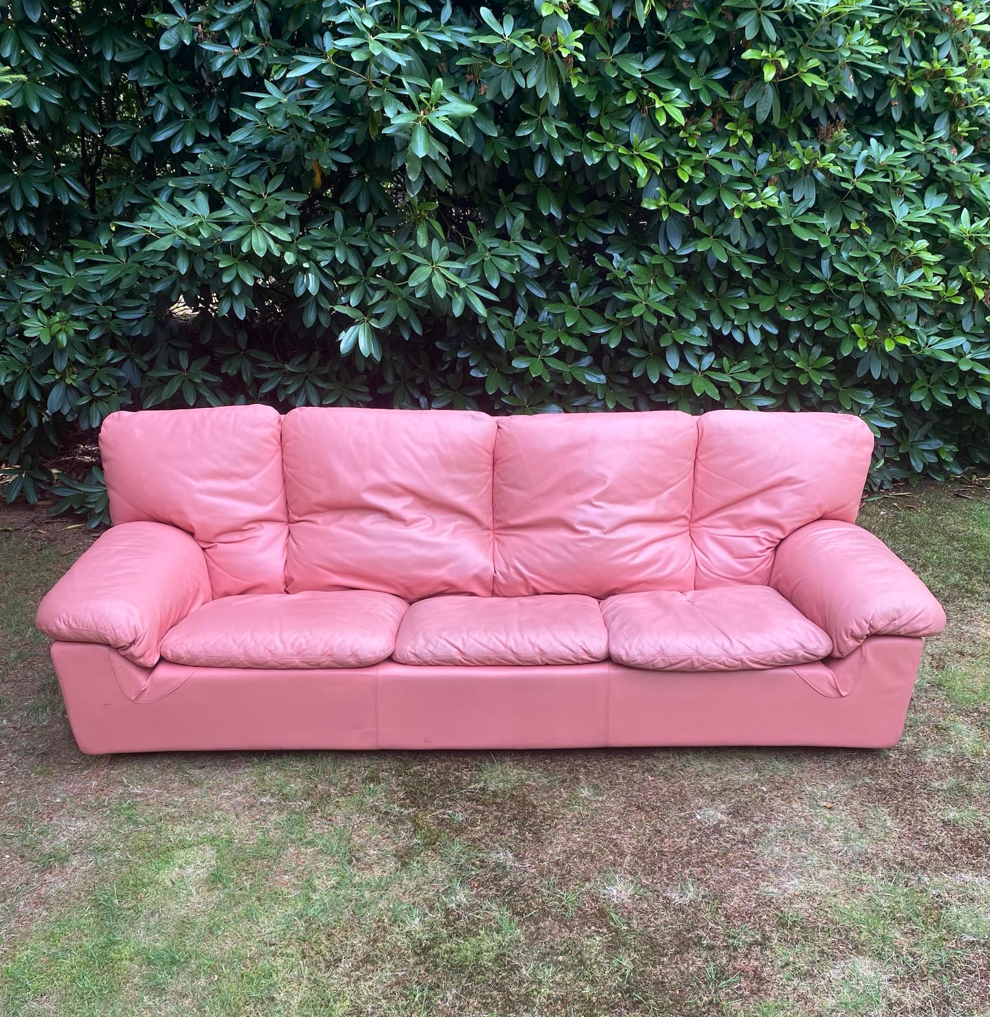 Great large leather sofa in Salmon-Pink Pastel and typical 1980s color. The sofa remains in good condition with some slight differences in color and other wear consisting with age and use (see:images). An advantage is that most of the cushions are