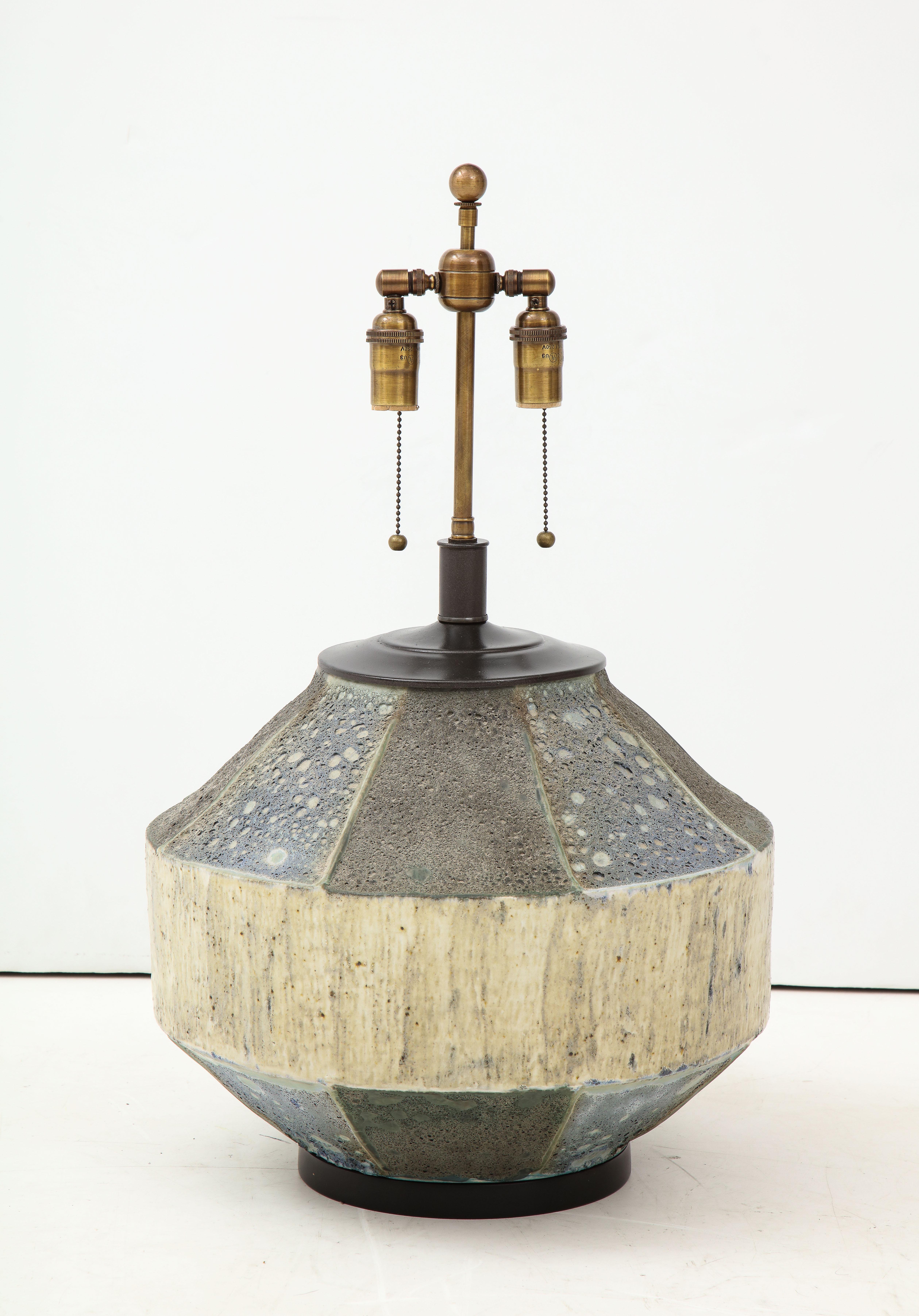 Wonderful large Brutalist ceramic lamp with a textured concrete like surface.
The lamp has been newly rewired with antique bronzed finish double cluster.