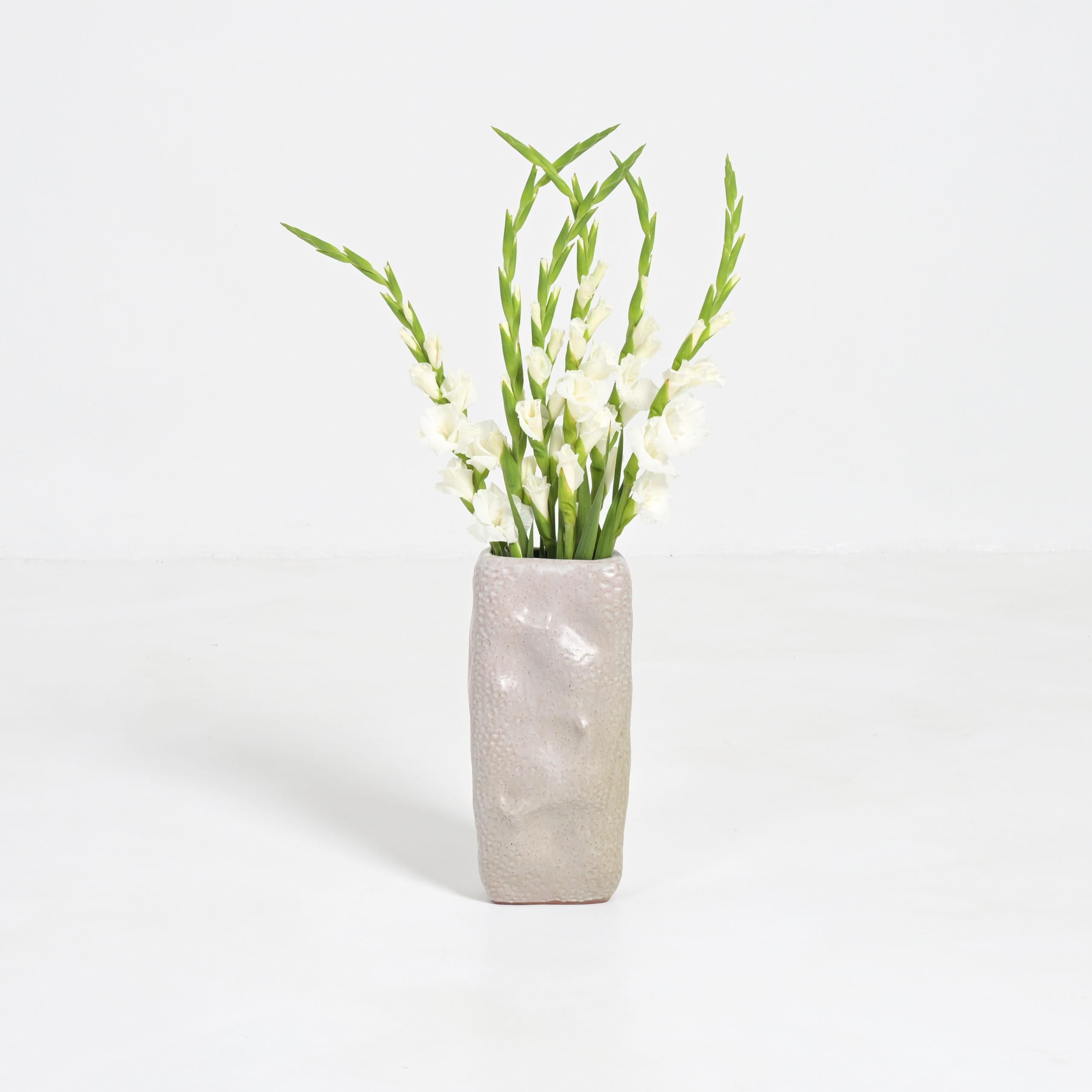 This large brutalist ceramic vase from the 1970s is beautiful with or without flowers.
It is like an abstract sculpture.
This vase is in very good condition. It is marked but we don’t know the artist.
