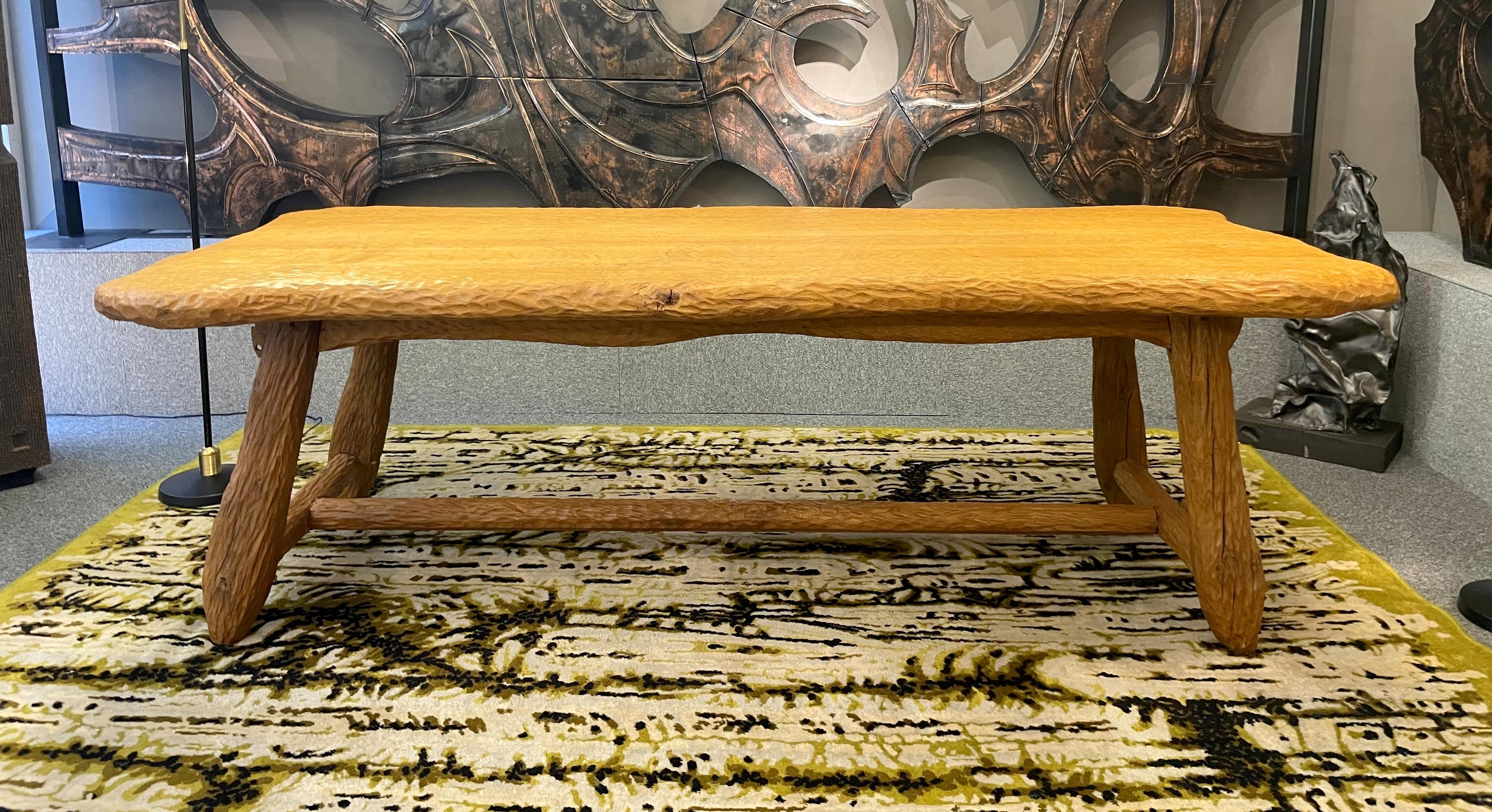 Unusual dining table in solid oak entirely handworked with a gouge.
The four legs are joined by a spacer. 
The tray is irregularly shaped.