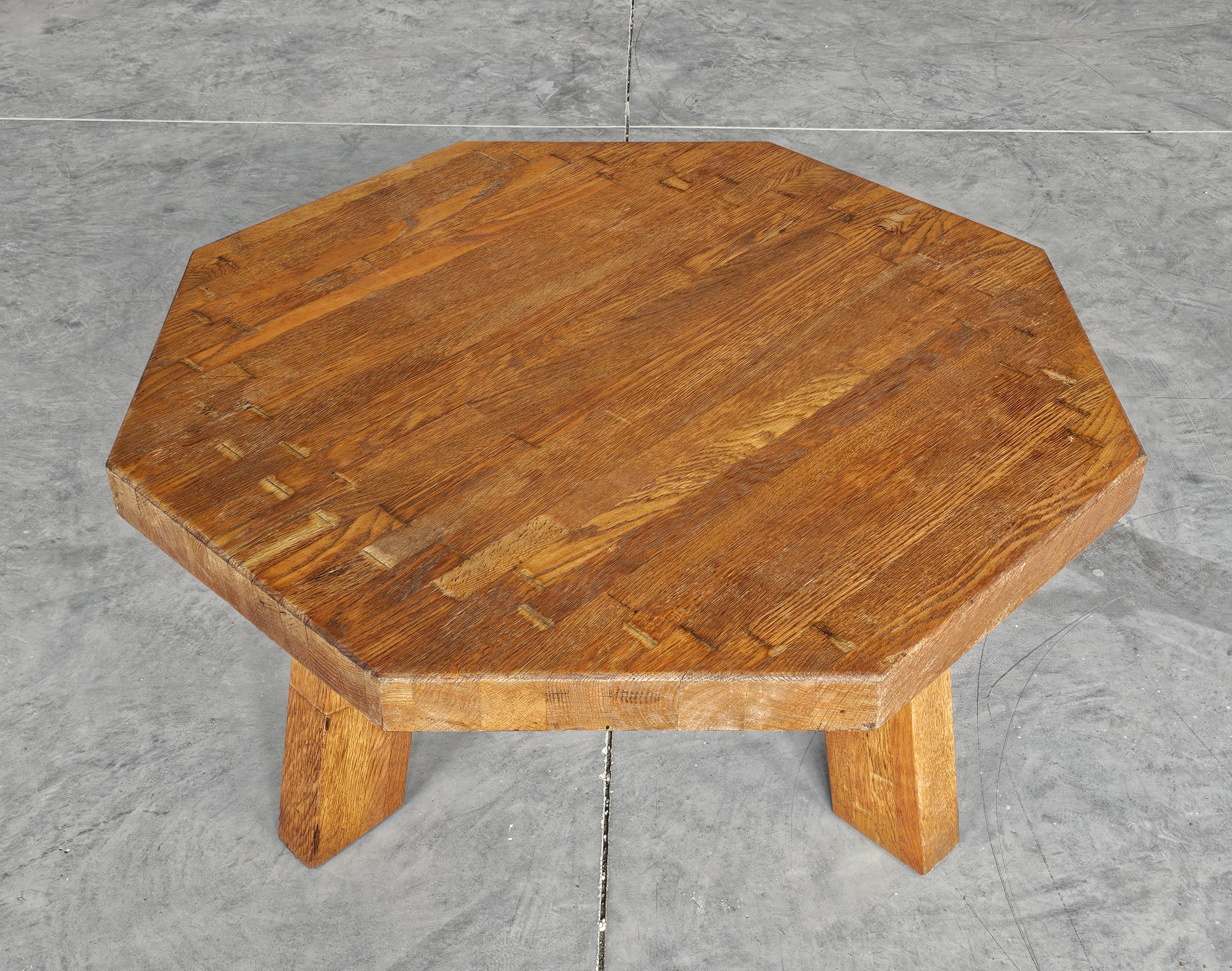 In this listing you will find a striking large Brutalist coffee table designed in style of Pierre Chapo. Table is done in solid oak, which makes it extremely heavy. Made in the Netherlands in the 1960s.

Good vintage condition with some signs of
