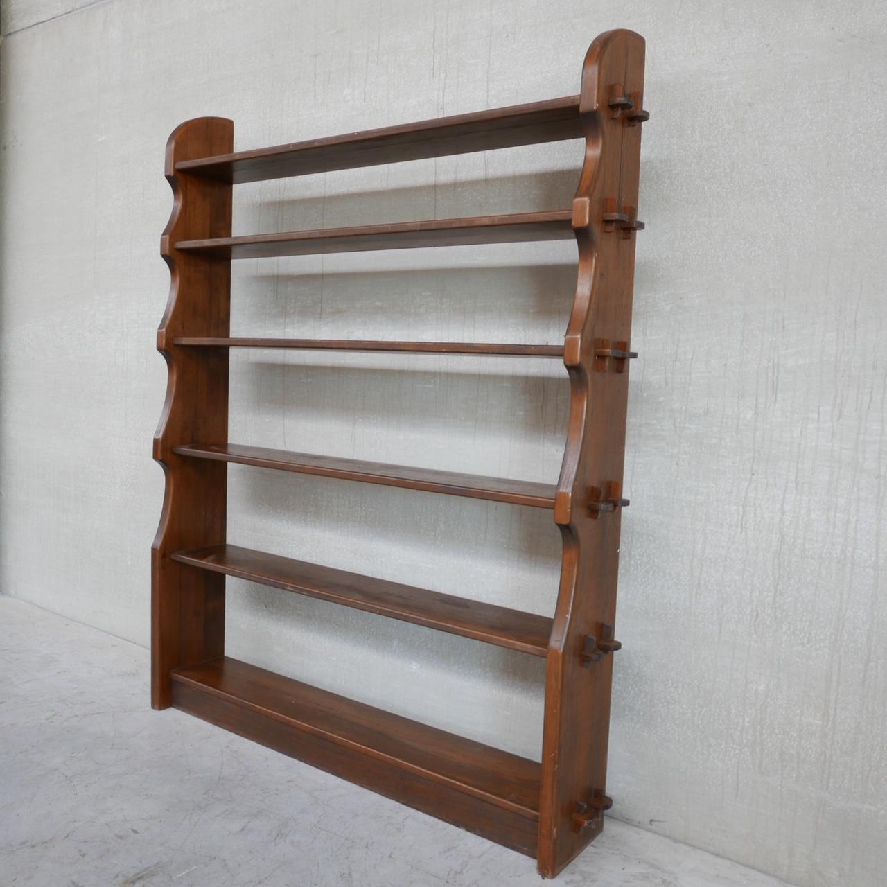 A large open bookcase. 

Finland, c1960s. 

Attributed to Olavi Hänninen for Mikko Nupponen.

Brutalist style with exposed peg joints. 

Some wear commensurate with age (see photos) but generally good condition. 

Location: Belgium