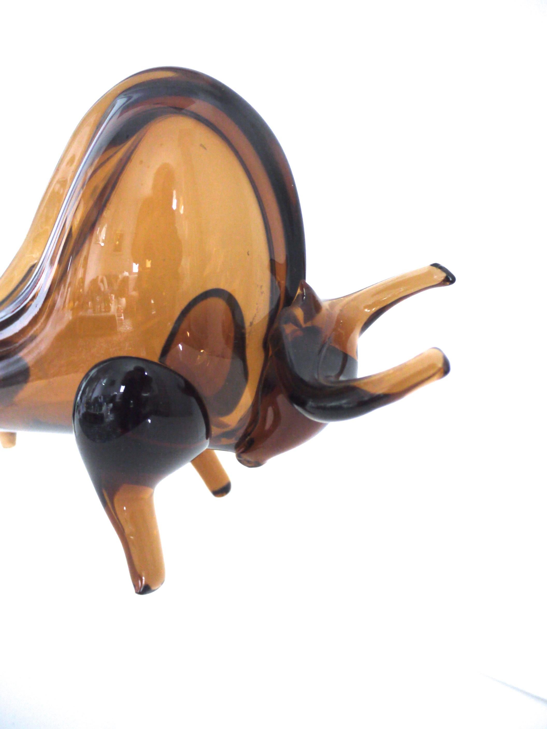 Brutalist, Space Age, modernist Murano abstract bull with applied features, 1970s

Measures: Length 28 cms
Height 17 cms
Width at widest 8 cms, weight 0.934 kgs.