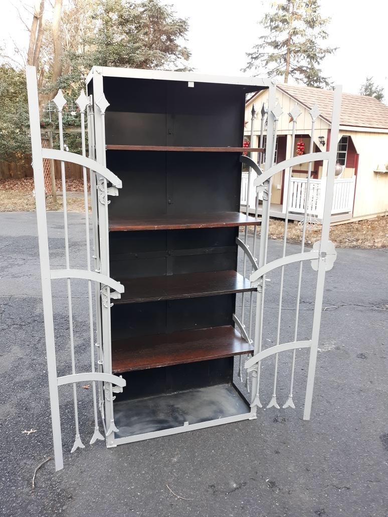 Unique cabinet made from iron gates and a steel cabinet. With several layers of old paint, mid-20th century.