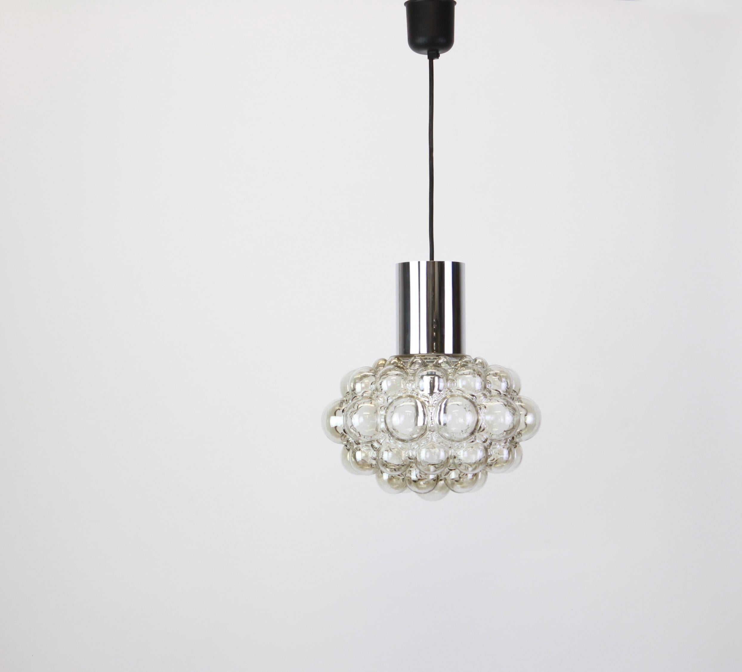 A large round bubble glass pendant designed by Helena Tynell for Limburg, manufactured in Germany, circa 1970s.

Sockets: needs 1 x E27 standard bulb with 100W max each and compatible with the US/UK/ etc standards
Drop rod can be adjusted as