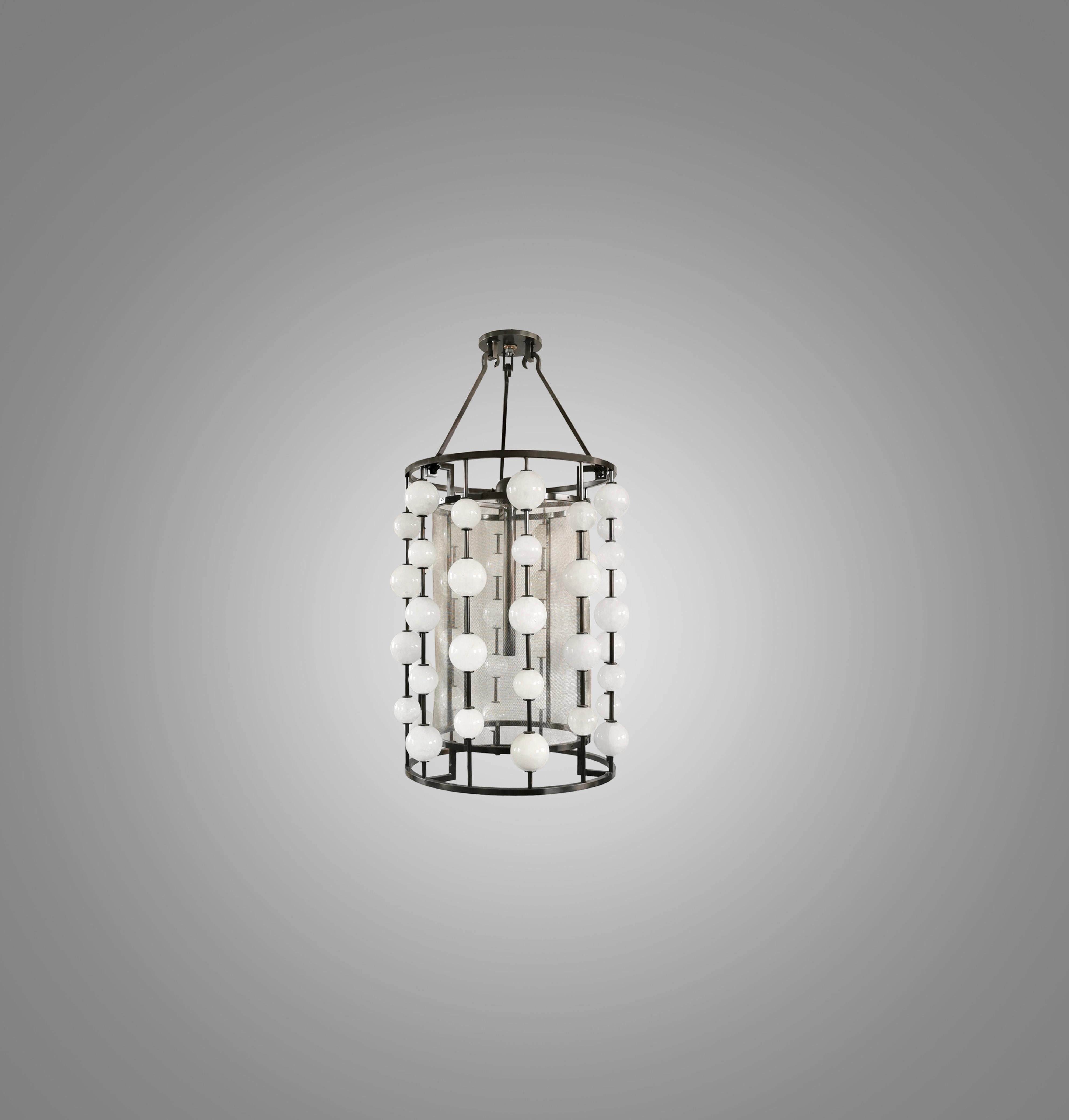 Rock crystal bubble pendant light with antique brass frame. Created by Phoenix Gallery, NYC.
Two sockets installed. E26 base light bulbs. 80w long tube lightbulb. 160w total. 
Height can be adjustable.
  