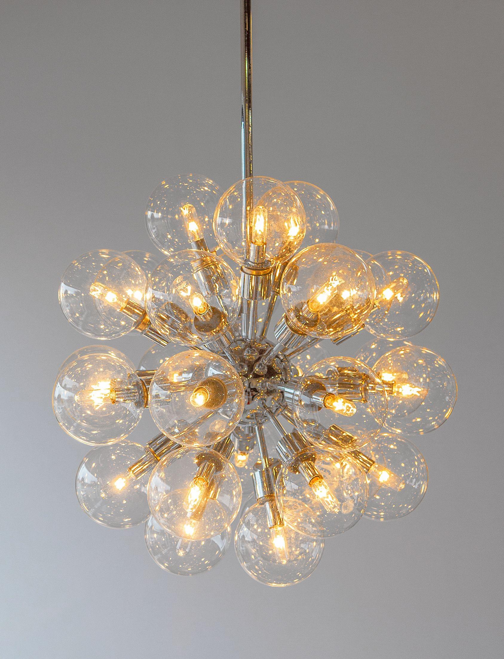 Extraordinary chrome sputnik chandelier designed by Motoko Ishii and produced by Staff Leuchten of Germany and distributed by Lightolier to the American Market.

All original decorative blown glass bubbles are intact and free of damage.

Motoko