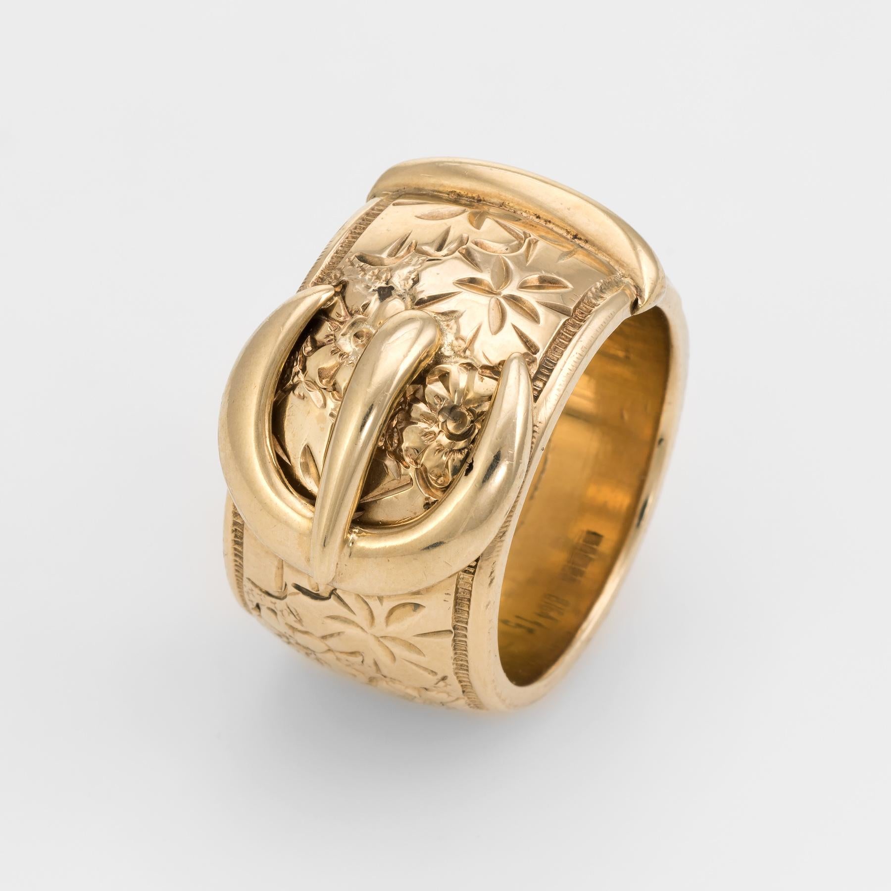 Finely detailed vintage buckle ring (circa 1978), crafted in 9 karat yellow gold. 

The buckle ring holds a lovely sentiment, representing the joining of two lives. The band features an etched flower and foliate design. The ring was made for a man
