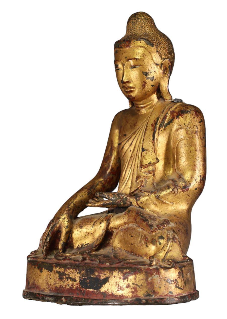 Gilded bronze Buddha in position to witness the earth, 19th century, Mandalay period (1853 - 1948)

Mandalay was considered the center of the Buddhist universe in Myanmar. King Mindon moved the capital from Amarapura to this new location and renamed