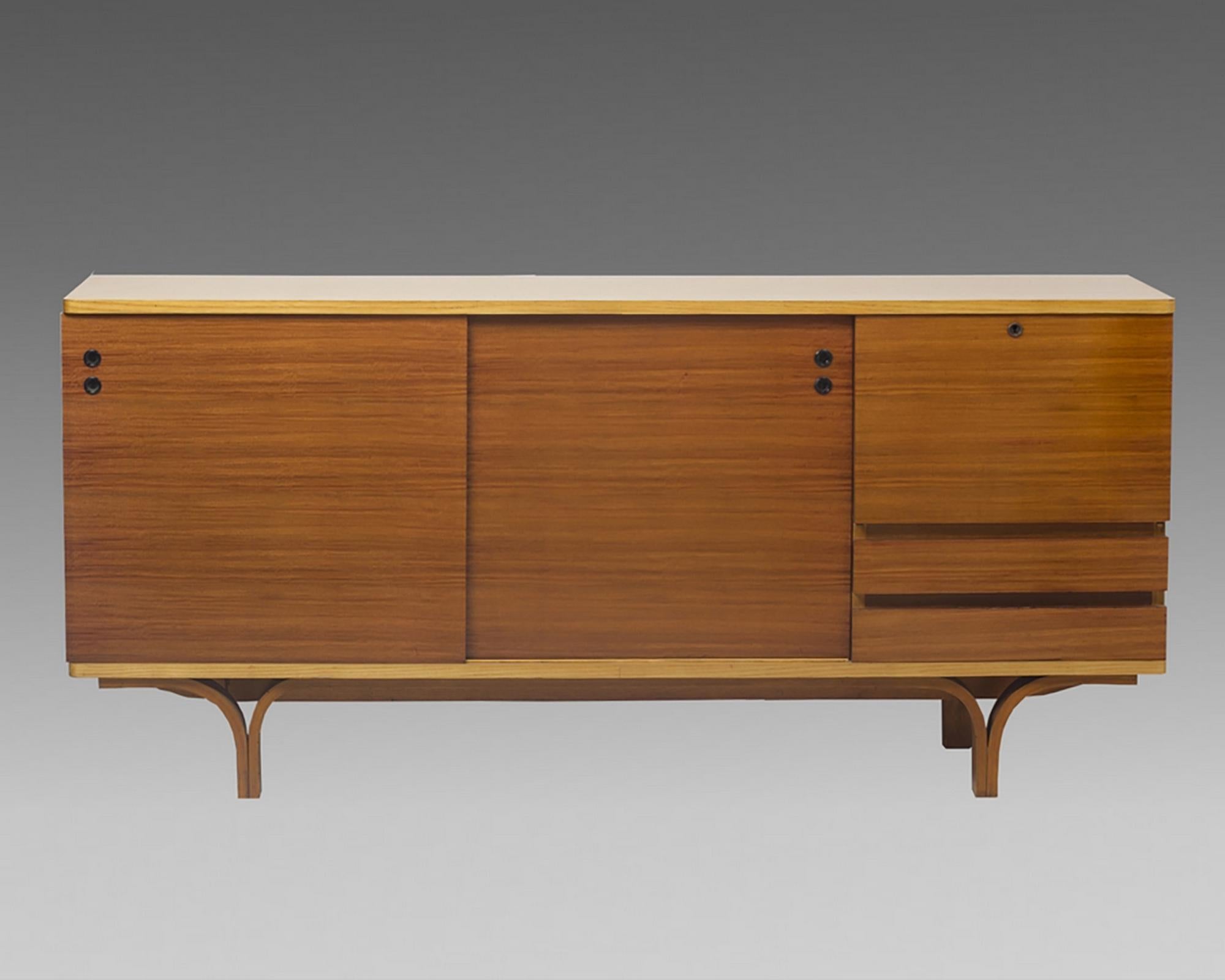Joseph-André Motte, sideboard with two sliding doors, a flap forming a bar and two drawers with mahogany in front, structure and curved legs in ash tree. Group 4 Charron Edition, 1955.

Total height: 2 ft / 10.25 in
Feet height: 8.66 in

