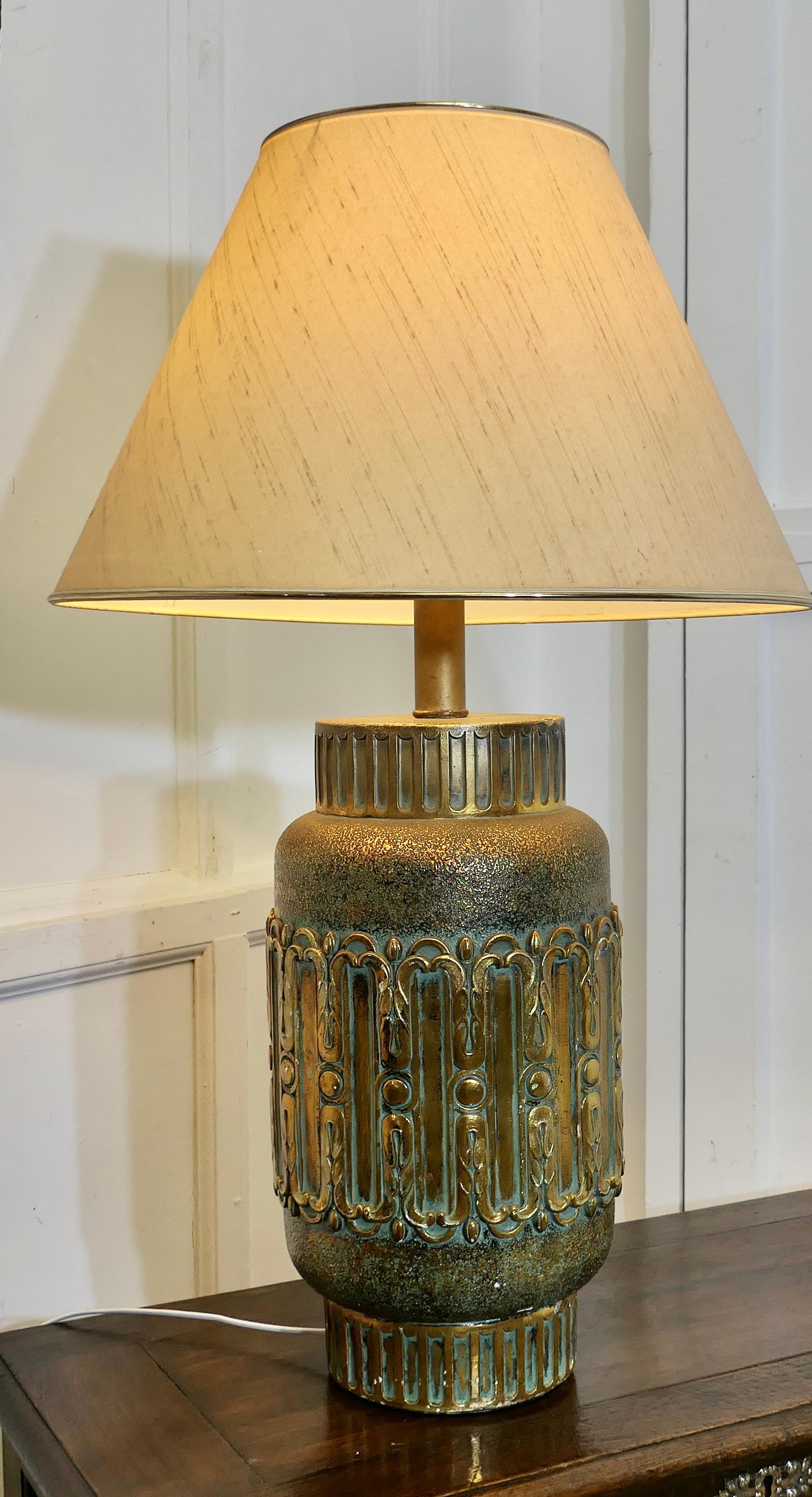 Large Bulbous Simulated Brass Ceramic Vase Lamp

This is an unusual and heavy lamp, it has a large bulbous decorative base and comes with it’s own linen look shade 
The lamp is fully wired and in good condition, a statement piece in any room
The