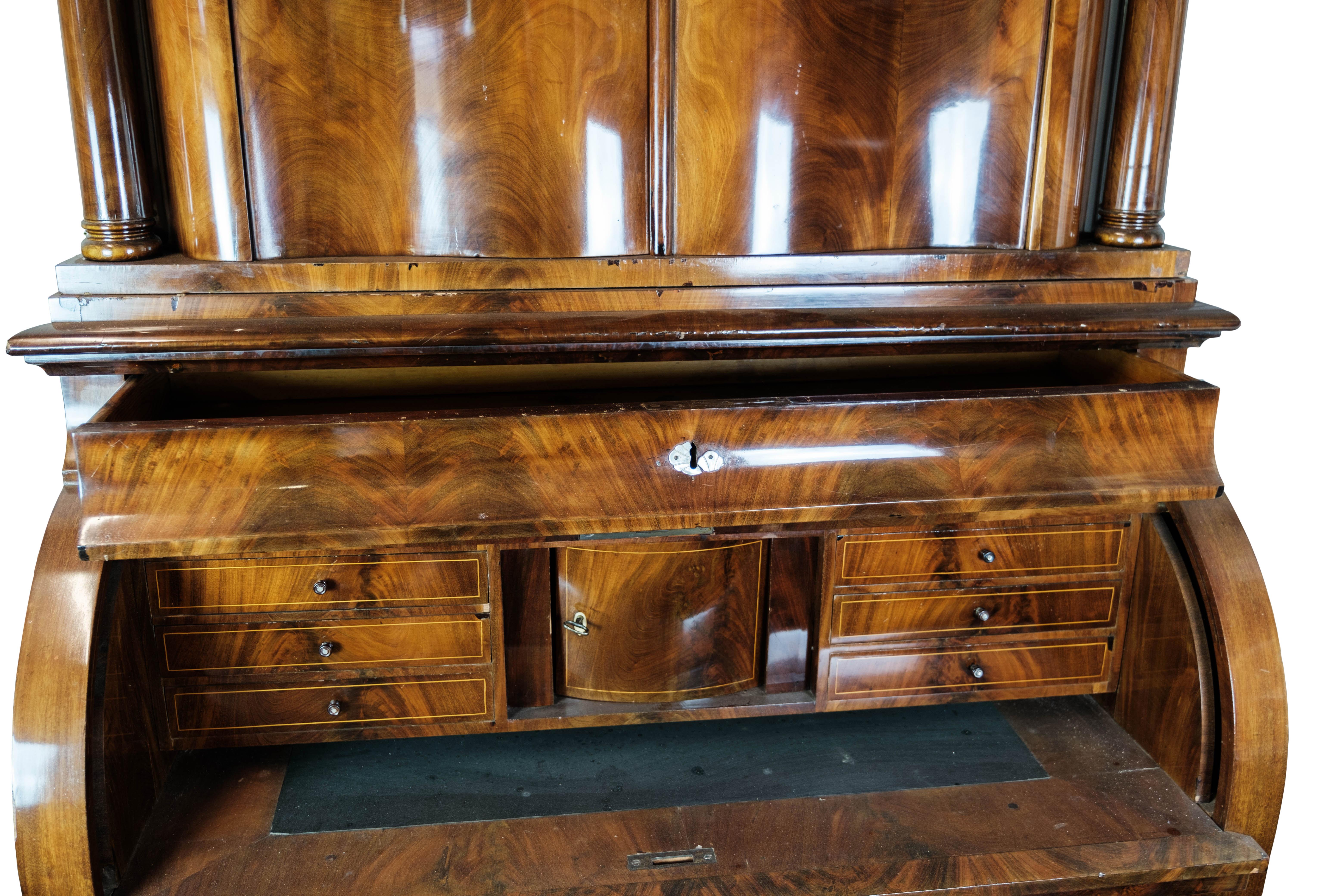 Large bureau of hand polsihed mahogany from Copenhagen in the 1860s. The cabinet is in great vintage condition.