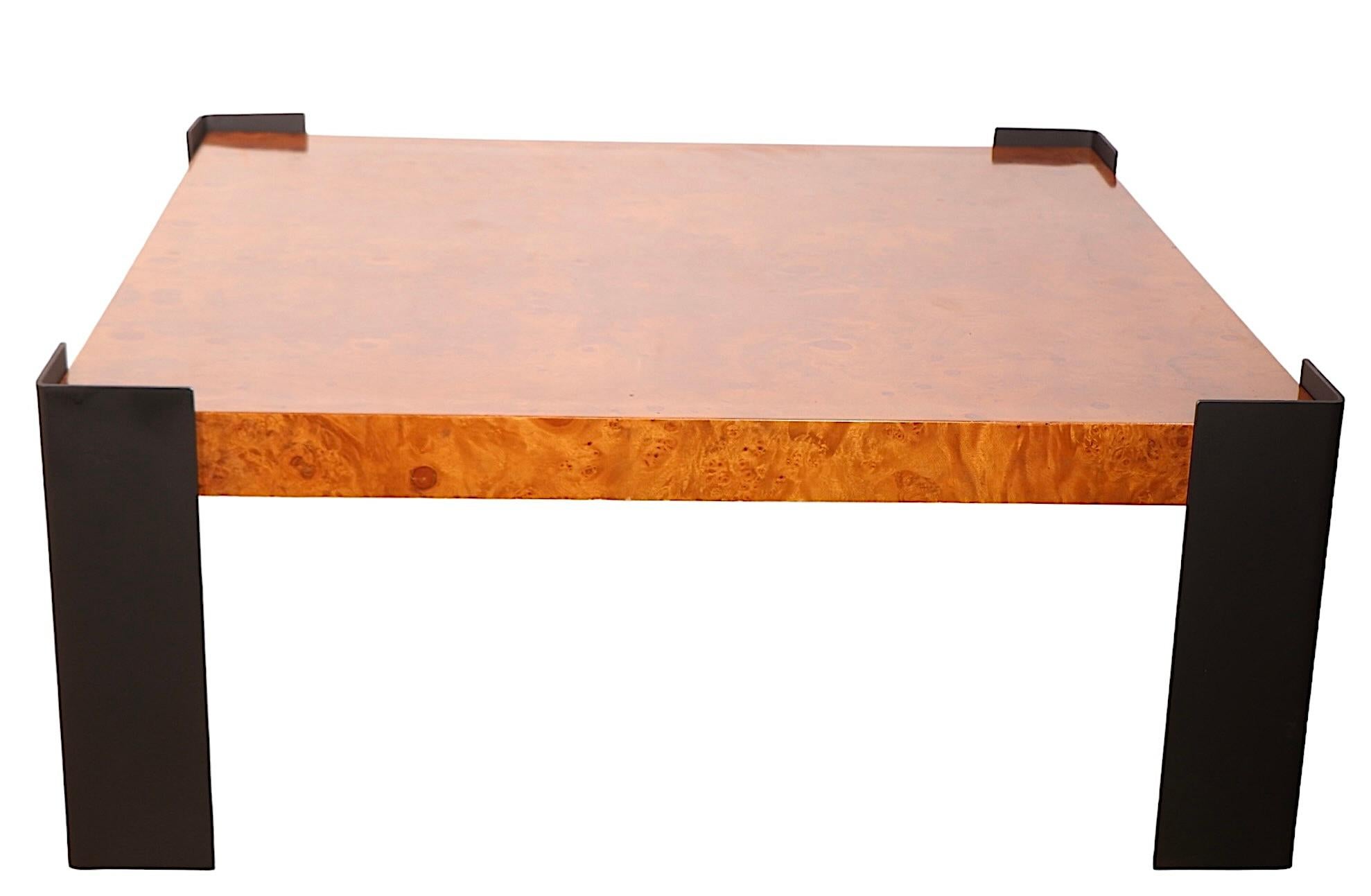 Voguish post modern architectural scale coffee table having a thick burl top with angle steel legs at the corners.  The table is in very good, clean, ready to use condition, the steel legs are in later black paint finish. Circa 1970's, design