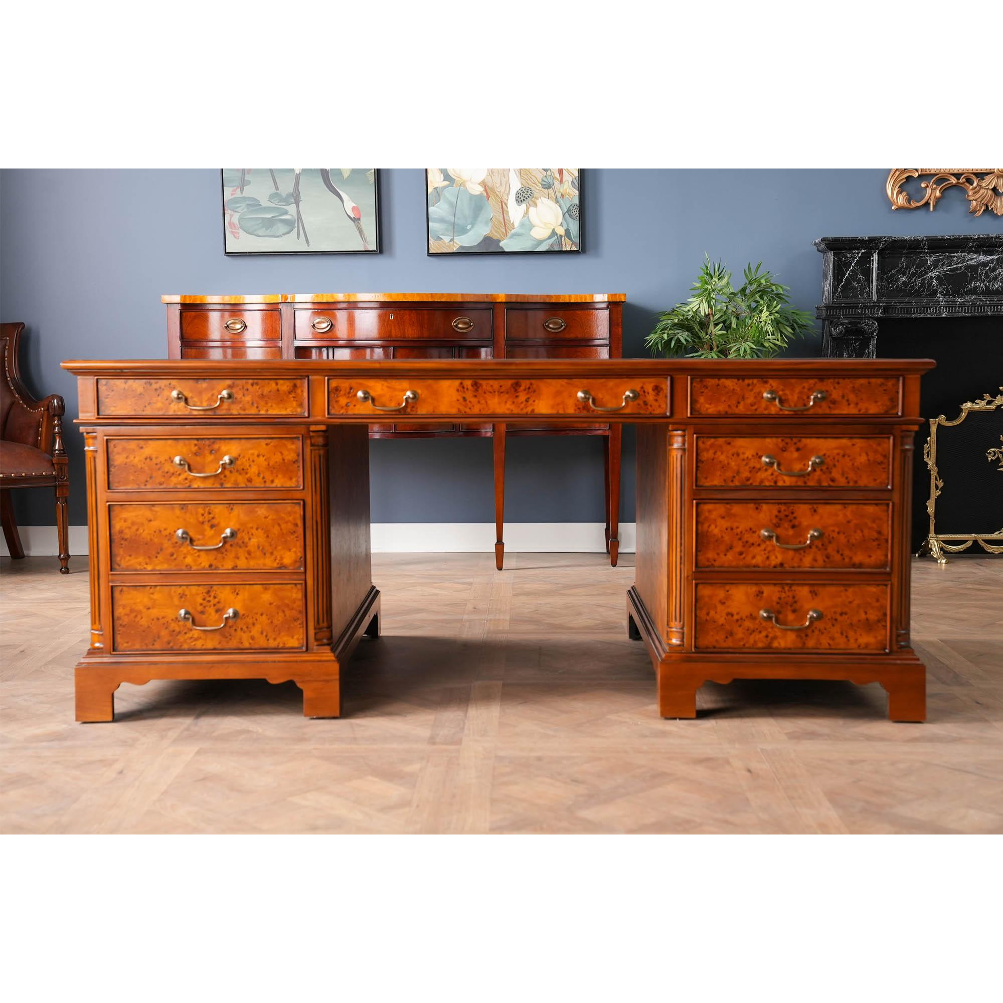 Equally suited for use either at the workplace or in a home office the Niagara Furniture Large Burled Executive Desk with tooled leather top is both decorative and functional. Built in three sections for easy handling and installation the top