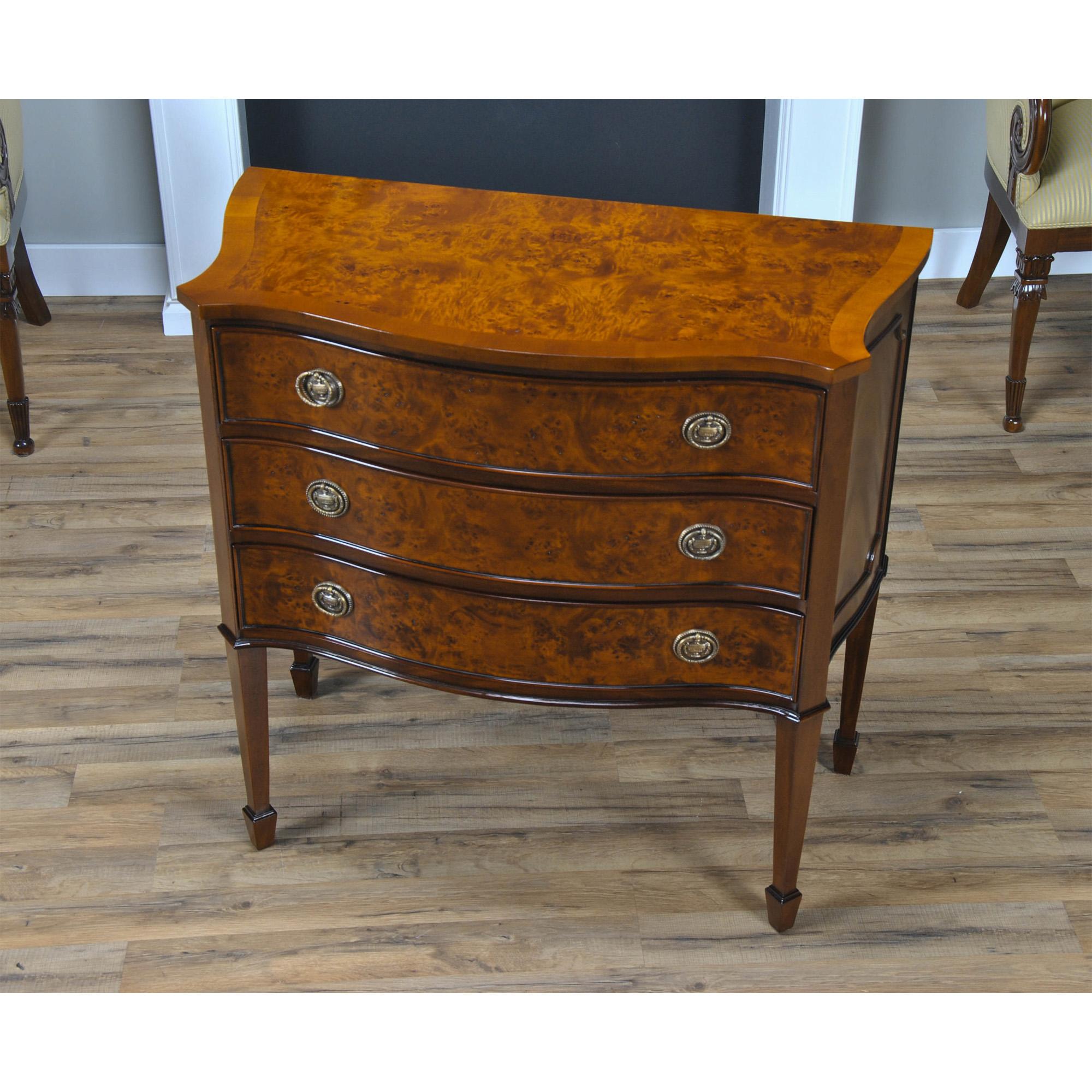This high quality, serpentine front Large Burled Hepplewhite Chest with dovetailed drawers is manufactured using plantation grown mahogany solids and hand selected burled veneers all of which are combined to create a decorative and refined chest.