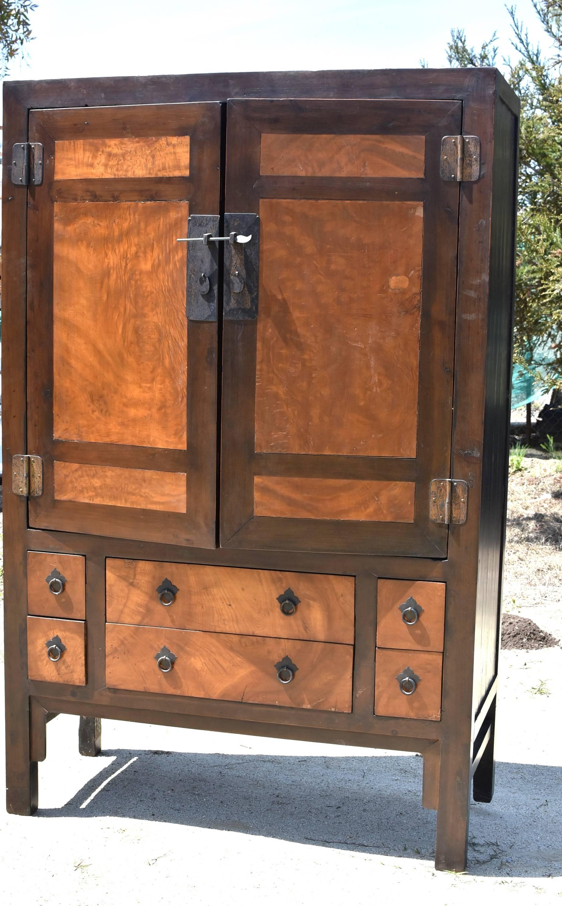 Blowout sale! A very large burl wood cabinet. The burl wood has beautiful swirling patterns. The contrast of burl's gold and framework's brown is elegant and stunning. Solid brass hardware. Six drawers, a removable shelf and a solid wood hanging rod
