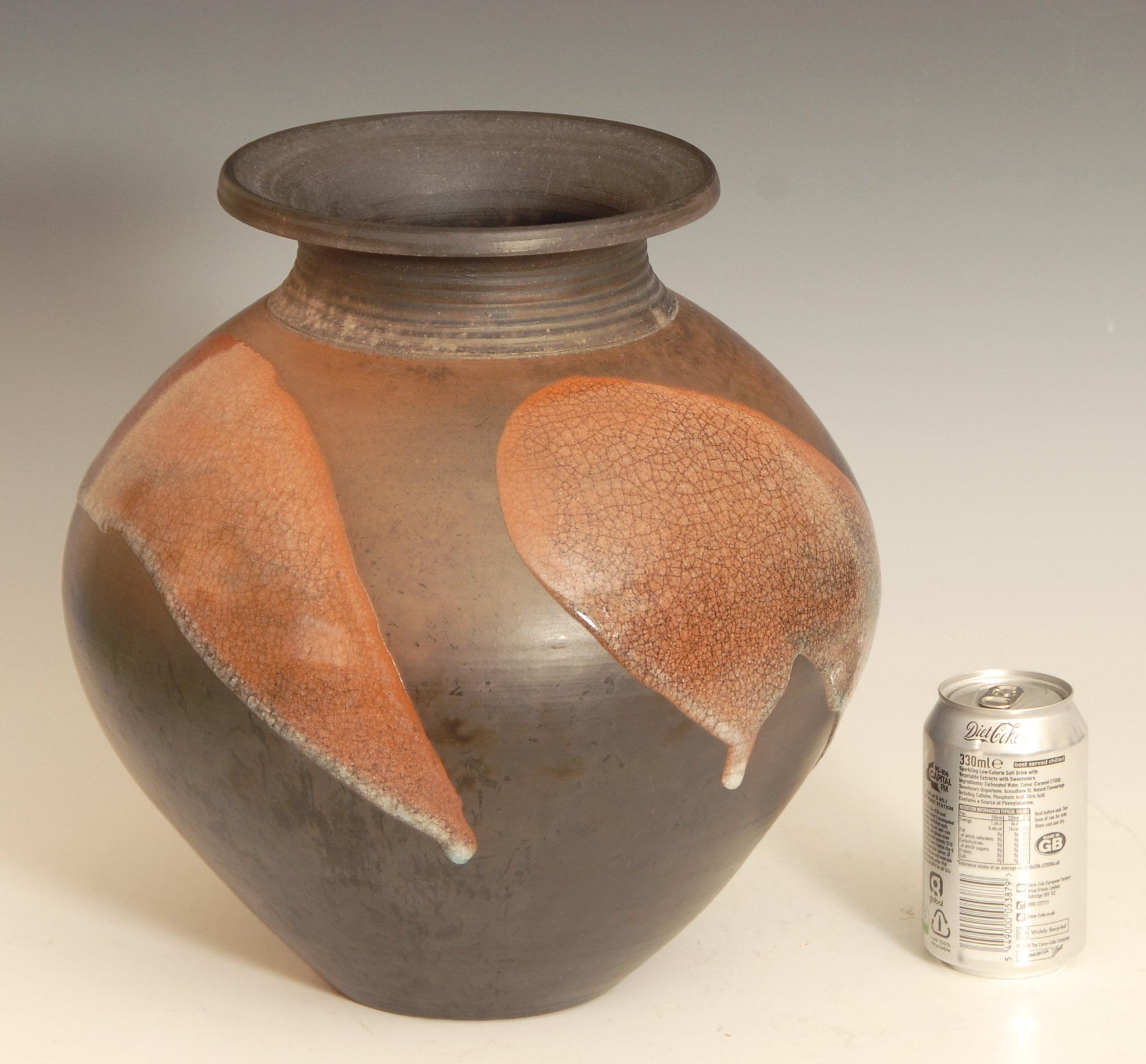 Large burnished raku pot or vase with crackle glaze by Tim Andrews of the UK.

Raku ware is a type of Japanese pottery traditionally used in Japanese tea ceremonies, most often in the form of chawan tea bowls.

Price includes free shipping to