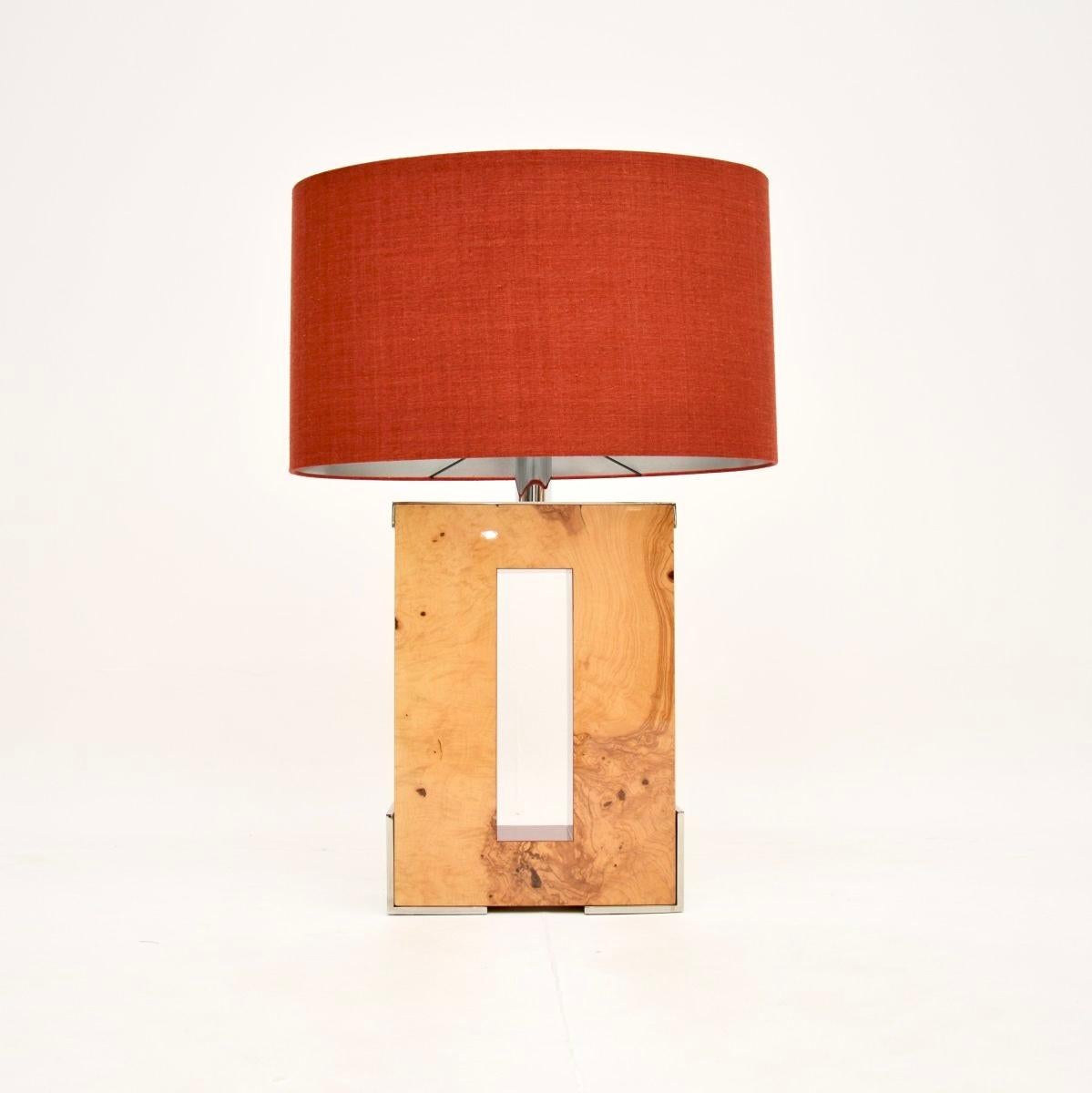 A fantastic and very large burr walnut and chrome table lamp by Oitoemponto, dating from the early twenty first century.

This came from an incredible central London home that was full of top end furnishing by high end design studio Oitoemponto, we