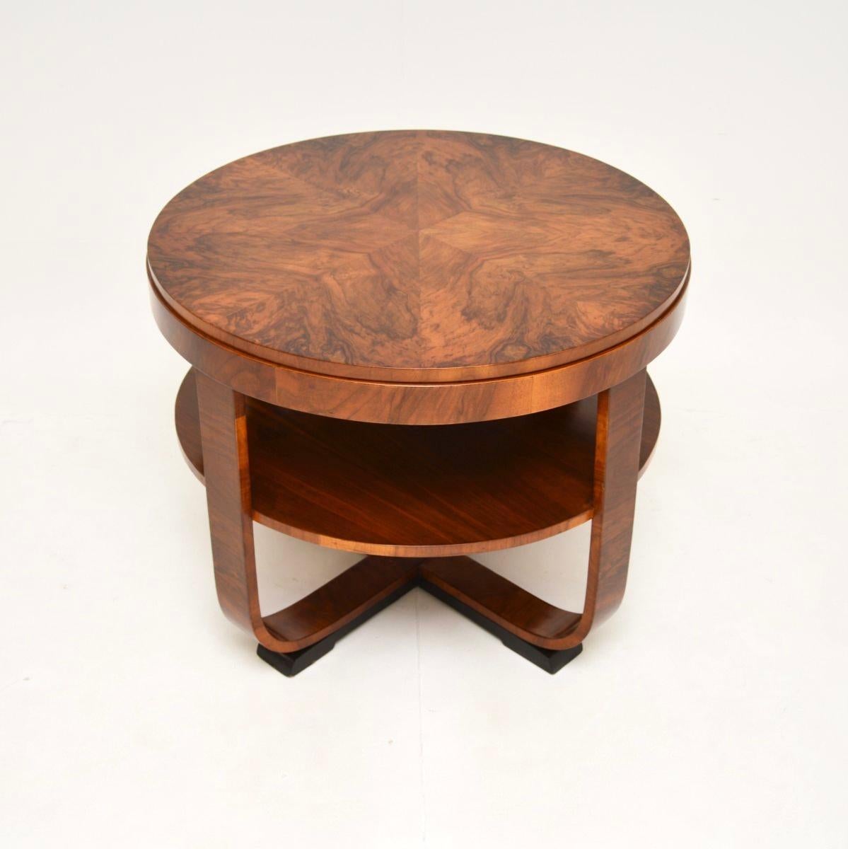A beautiful and large burr walnut Art Deco coffee table, made in England and dating from the 1930’s.

This is of outstanding quality, it is extremely well made and has a useful design. The circular top has a thick edge and stunning burr walnut grain