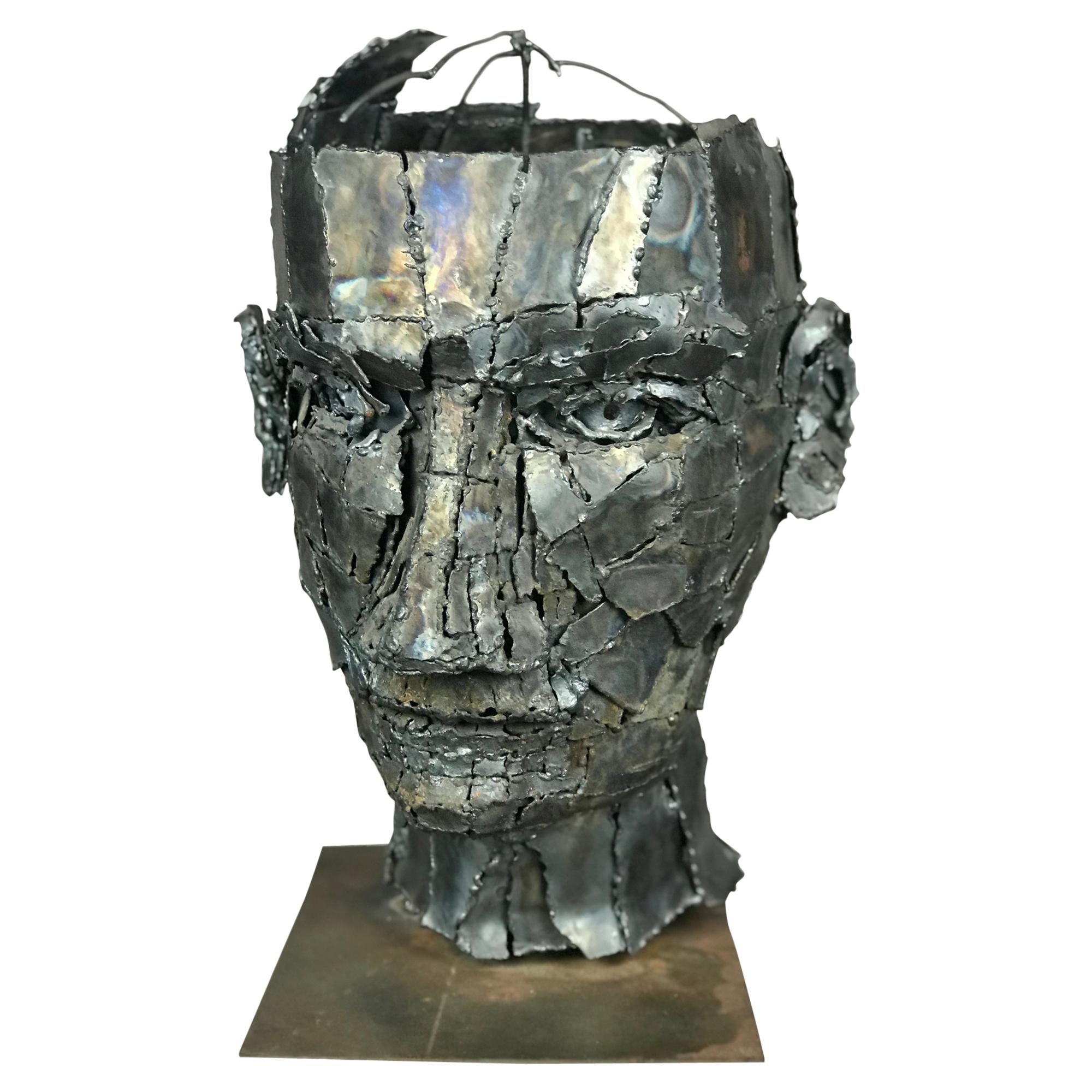 Oversized bust or head sculpture with patchwork torch cut steel pieces welded and braised on a frame. Incredibly figured and detailed expression. Has oxidation/age/wear on the inside and mounting plate. Artist unknown, circa 1960s-1970s when this