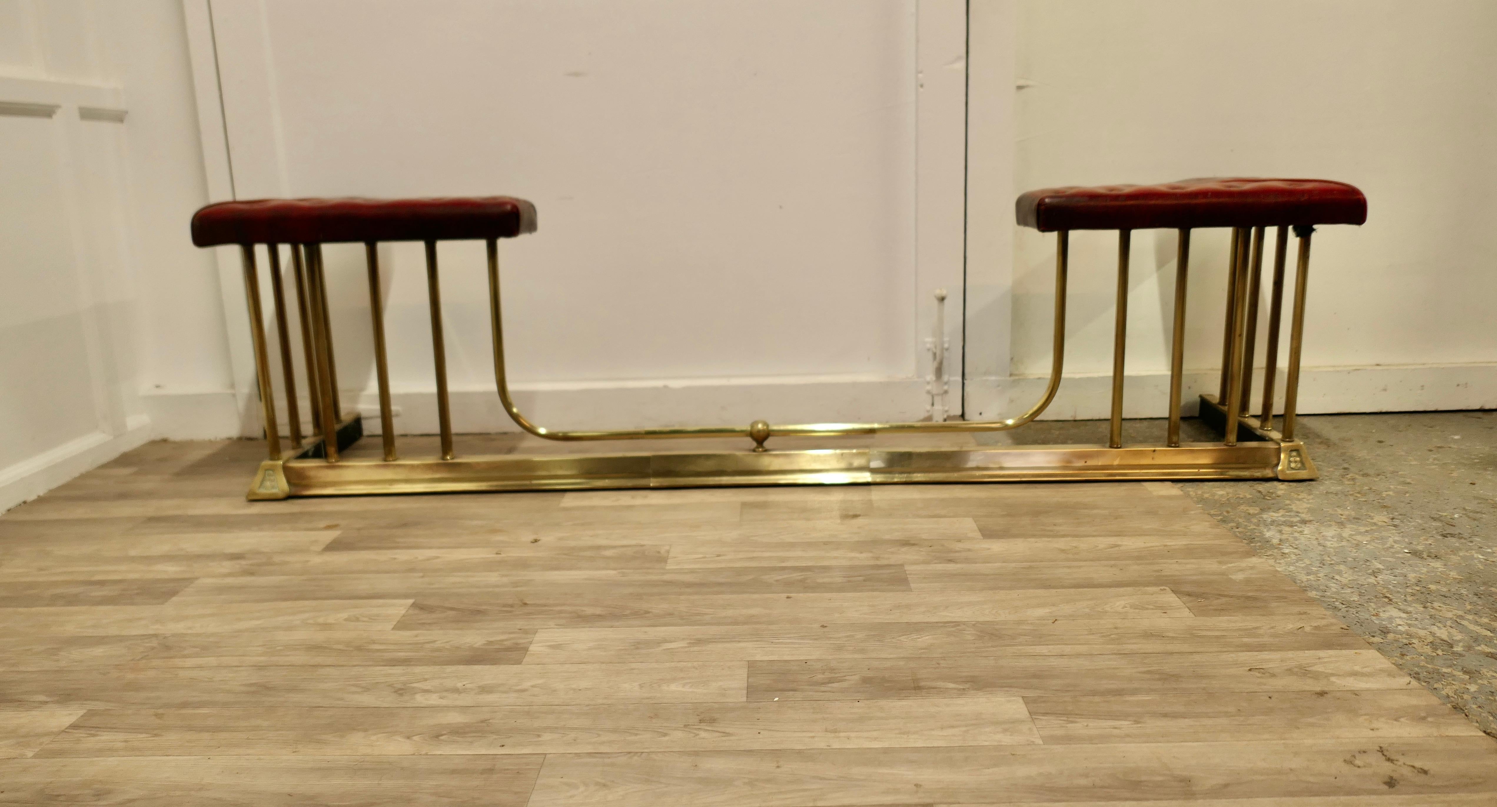 Large Buttoned Leather Extending Brass Club Fender

This is an elegant piece of country House Furniture with buttoned red leather seats and it can be pulled out to alter the size to fit your hearth  
The fender is in good all round good condition
