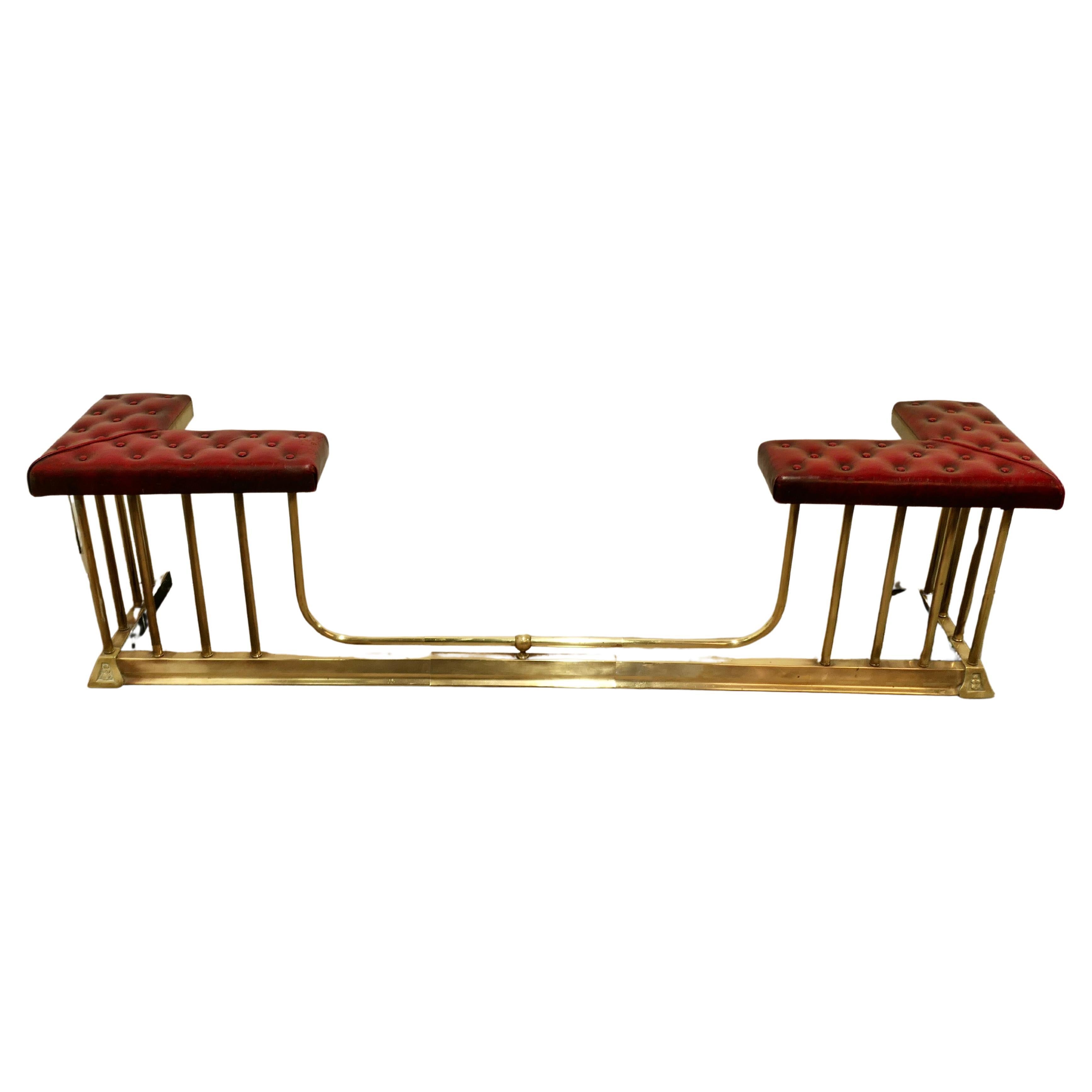 Large Buttoned Leather Extending Brass Club Fender  This is an elegant piece