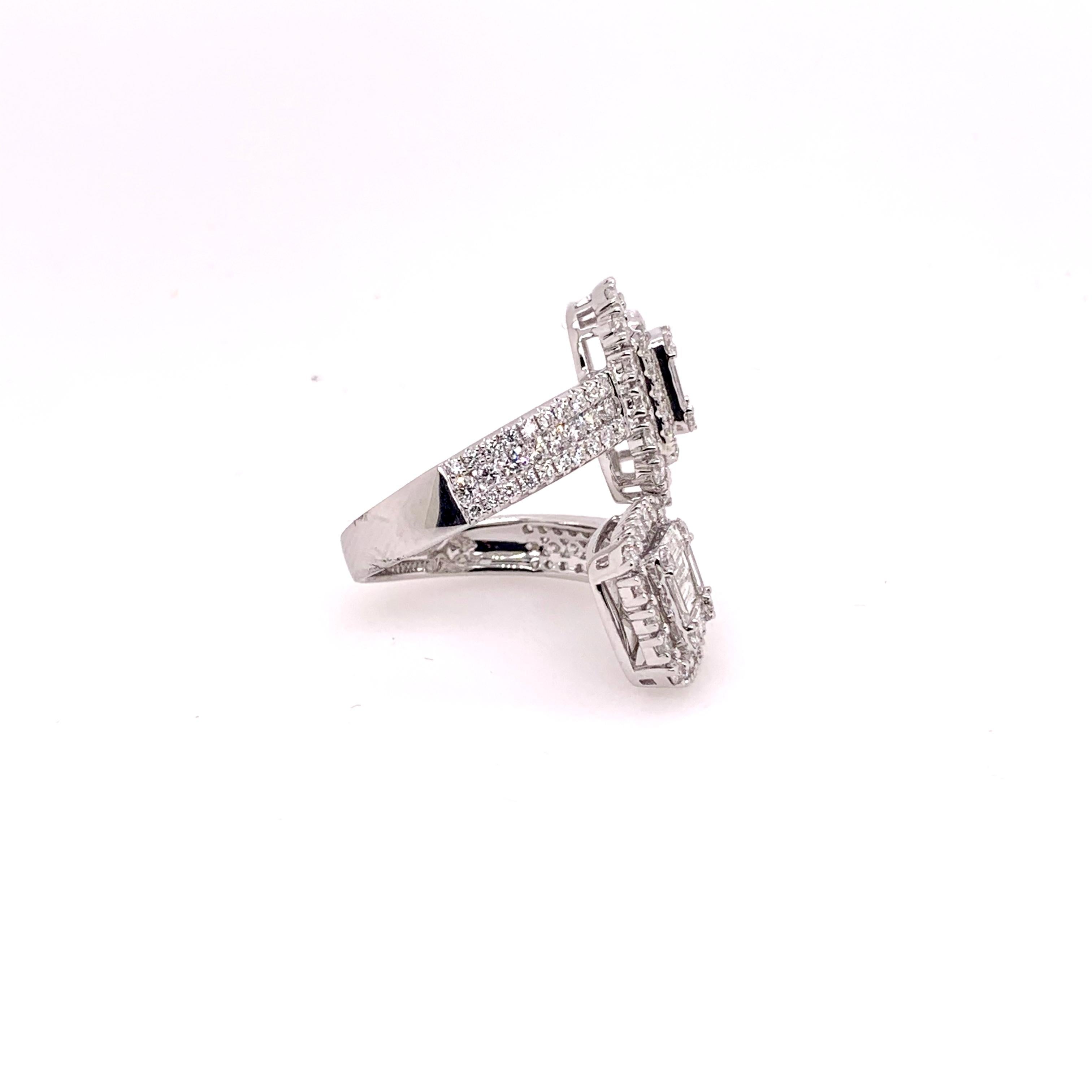 An unusual diamond bypass ring that will captivate everyone's attention.   Uniquely made in 18k white gold, it has a total of 3.46 cts of round diamonds and diamond baguettes.  This statement piece will be thoroughly enjoyed in any jewelry