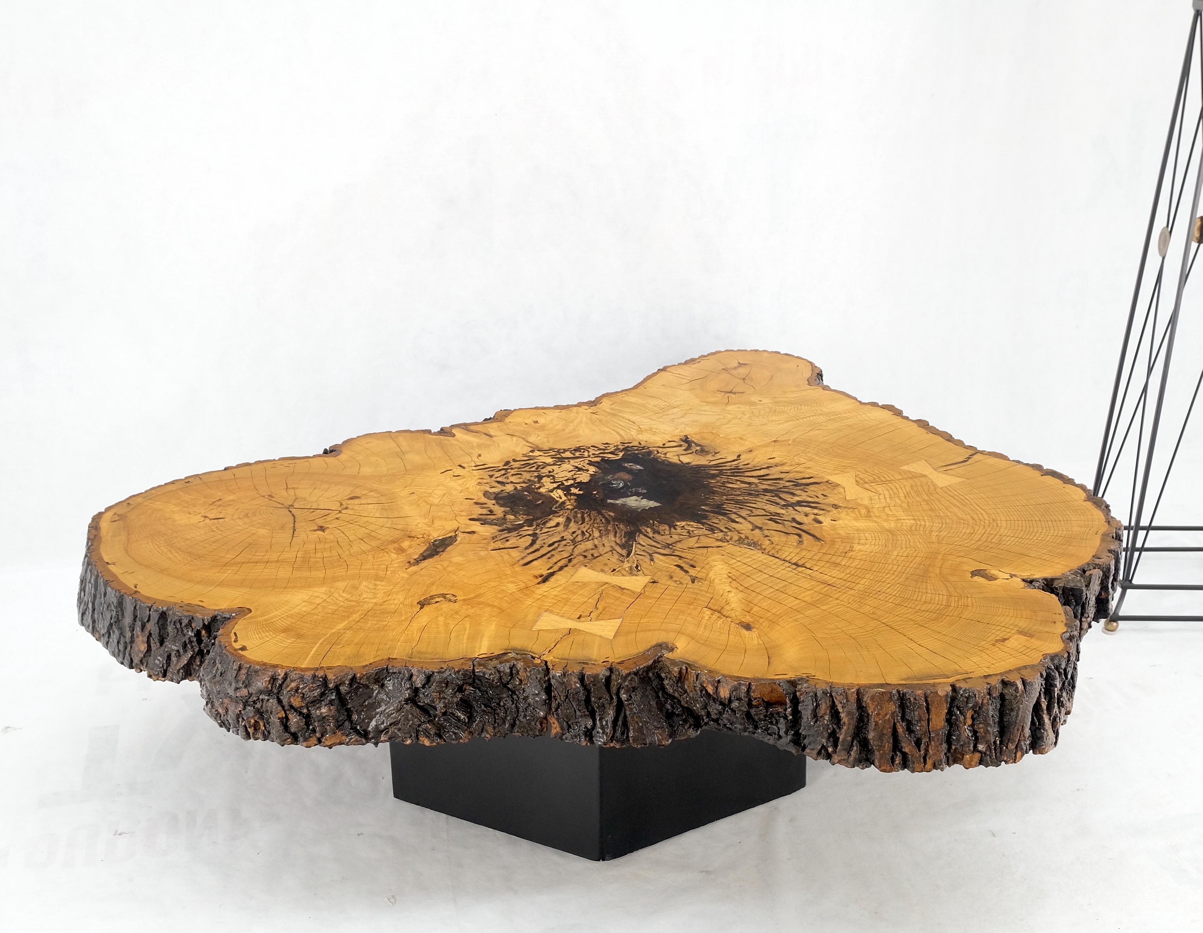 Large Vintage circa 1970s thick slab live edge organic coffee table butterfly joints nice patina!
Center is decorated with sea shell sealed in clear resin.