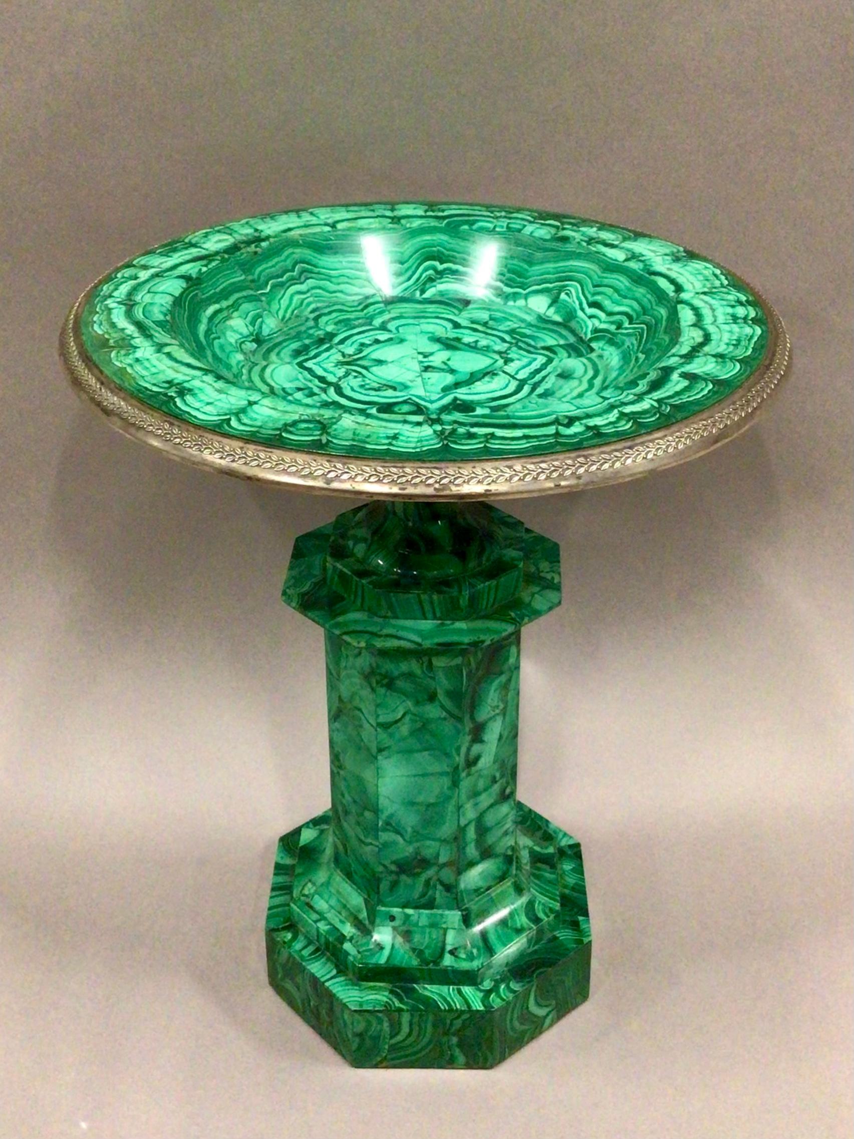 A spectacular early C19th Russian malachite tazza/urn of good scale and elegant form. The circular shallow dish with silvered-bronze mounted rim of styff leaf design, raised on a faceted spreading socle with octagonal pedestal with repeated