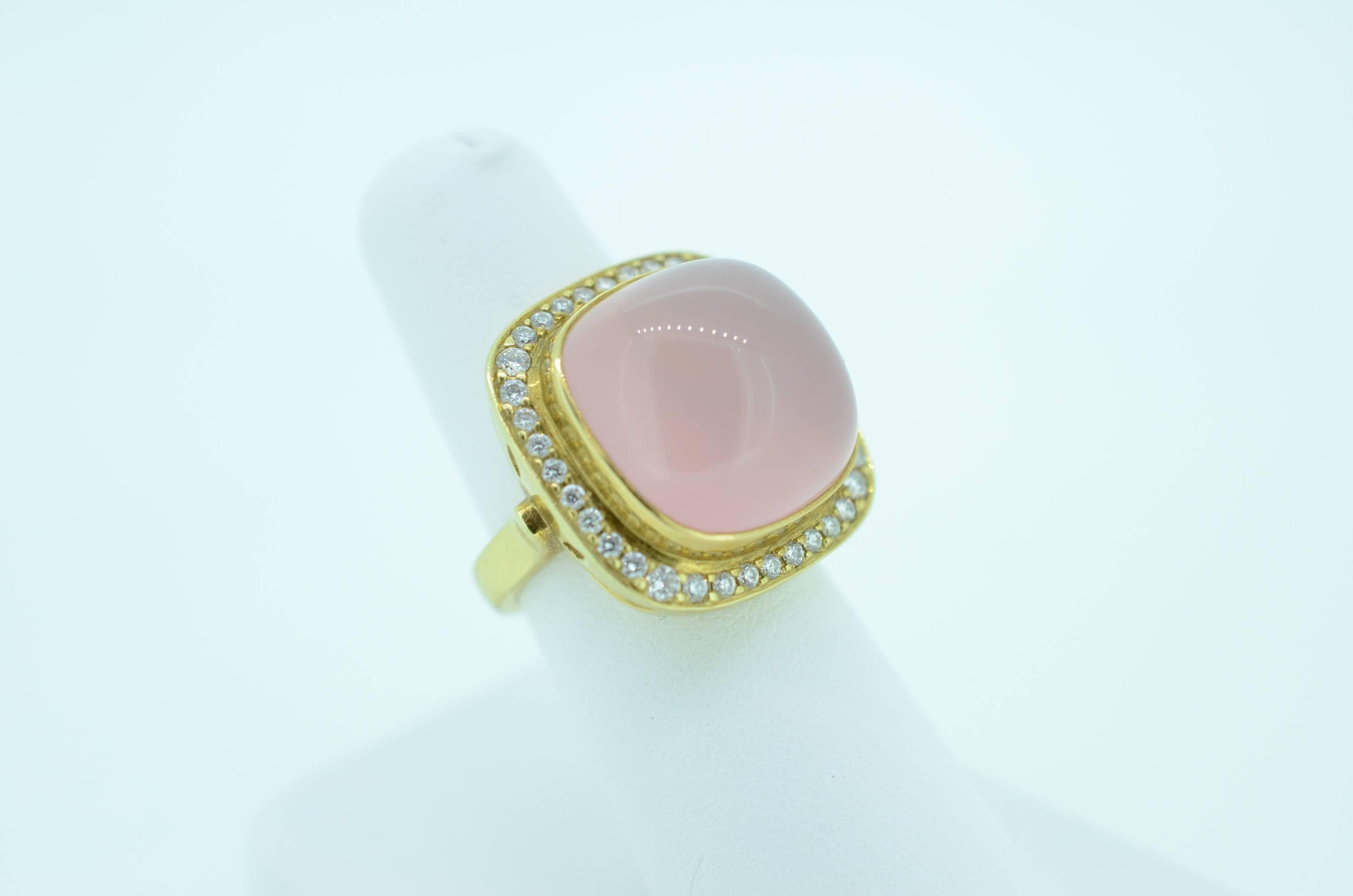 Beautiful one of a kind fabricated and cast Pink Quartz and Diamond Ring. Lost Wax process. 18kt yellow gold,22mm square Cabochon pink quartz with bead set diamonds framing the quartz. .50 total weight, VS clarity and G-H color.