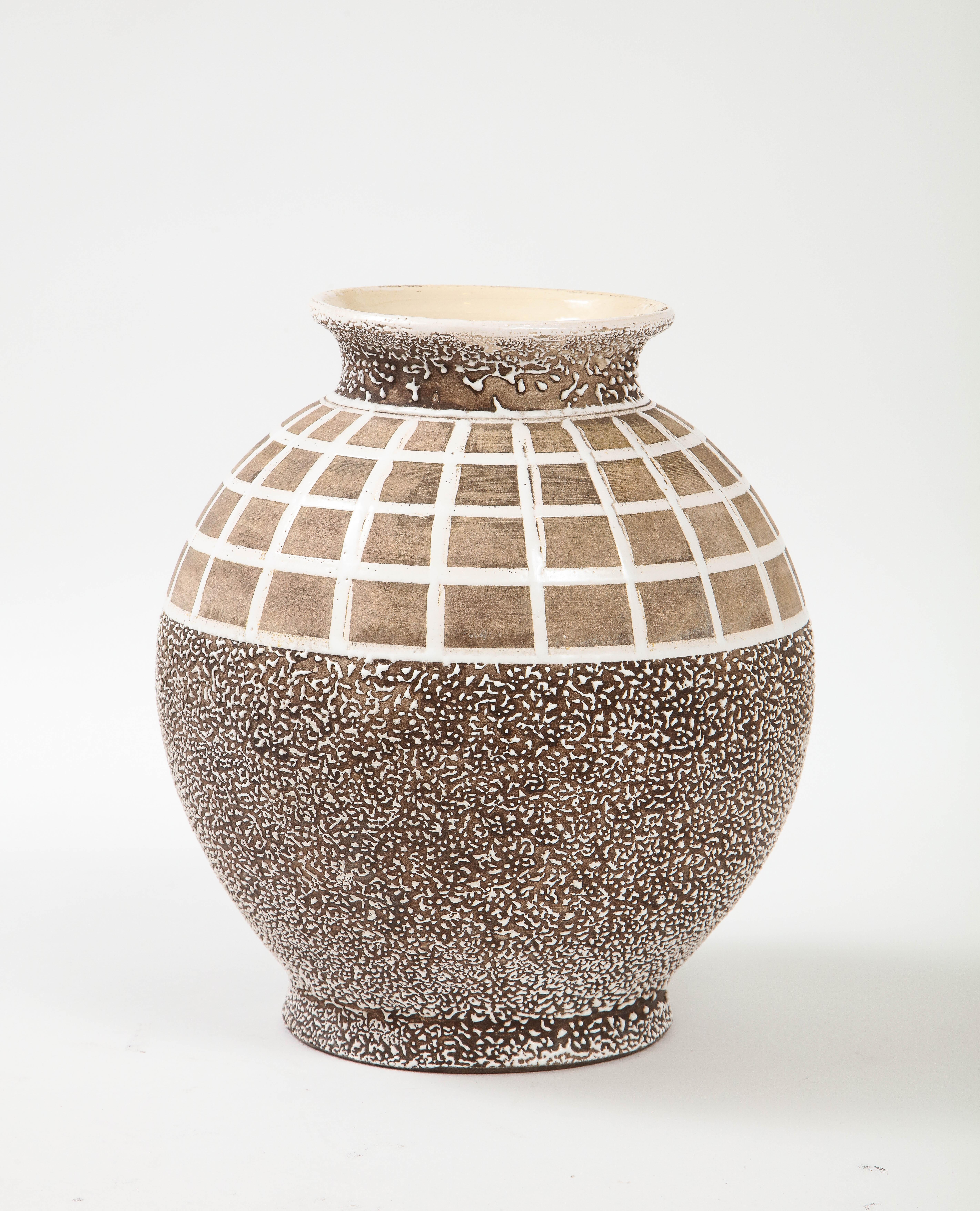 Very large for this type of vase, and unusually juxtaposed with the lattice work enamel design on the upper quadrant with dry under glaze contrasting the lower texture section.