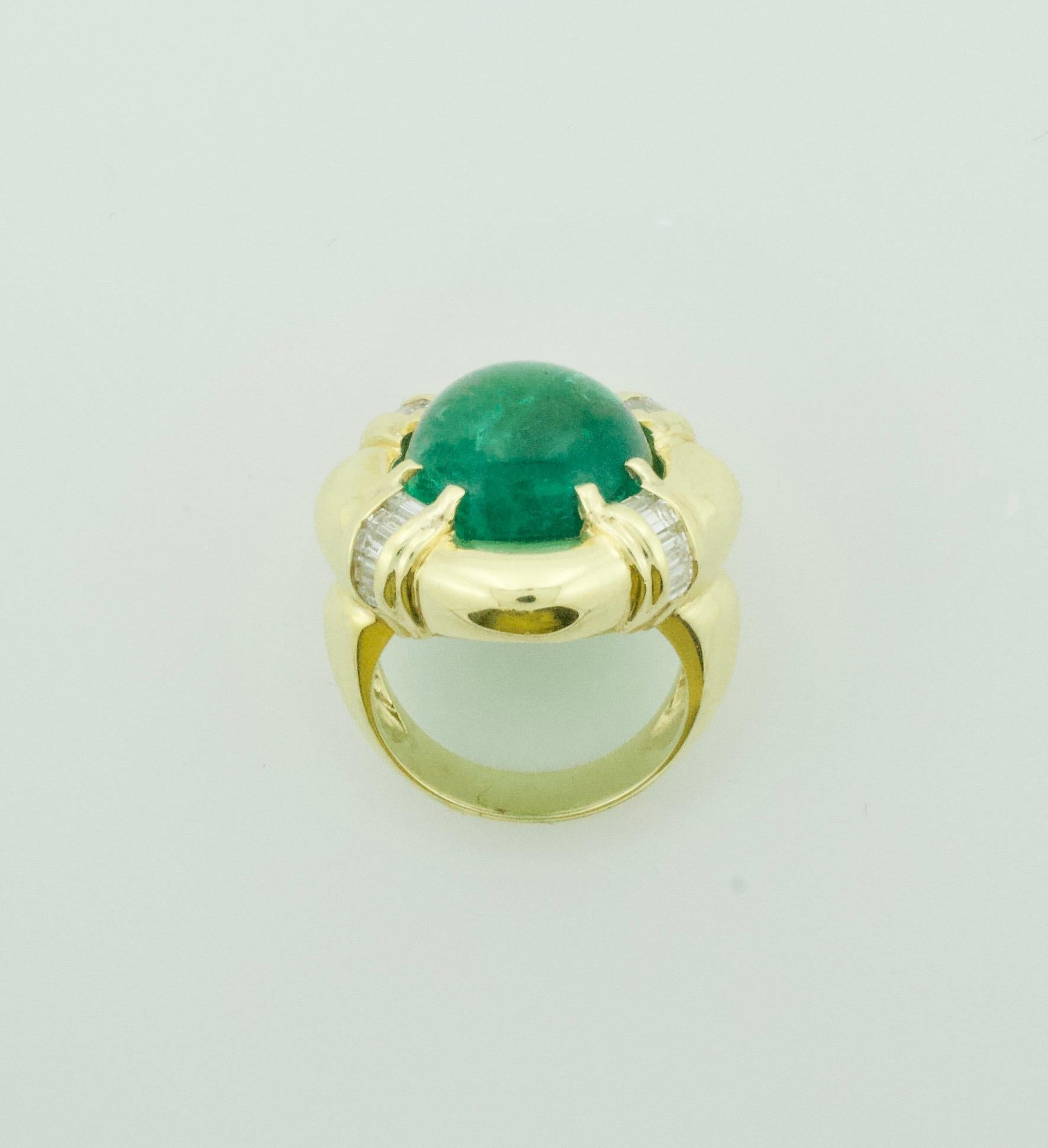 Large Cabochon Emerald and Diamond Ring in 18k Yellow Gold
One Cabochon Emerald Weighing 16.08 Carats [Beautiful Color and Vibrancy] 
Twenty Baguette  Cut Diamonds Weighing 1.14 Carats [GH VVS-VS] 