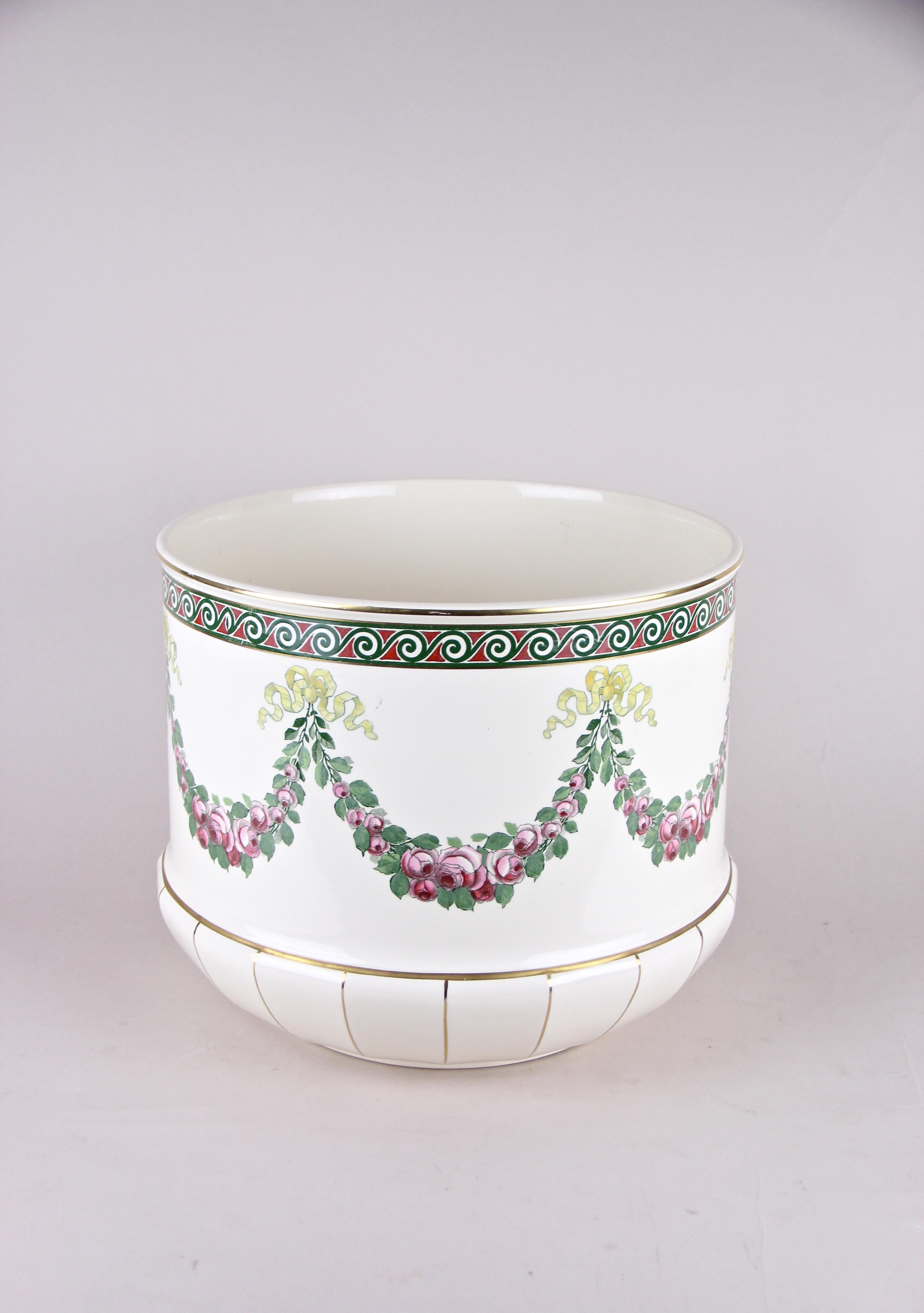 From the early 20th century comes this great cachepot from the world renown manufacture of Villeroy & Boch. A Fine large cachepot adorned by flower garlands surrounding the whole piece and Fine golden lines on the bottom. This item comes in perfect