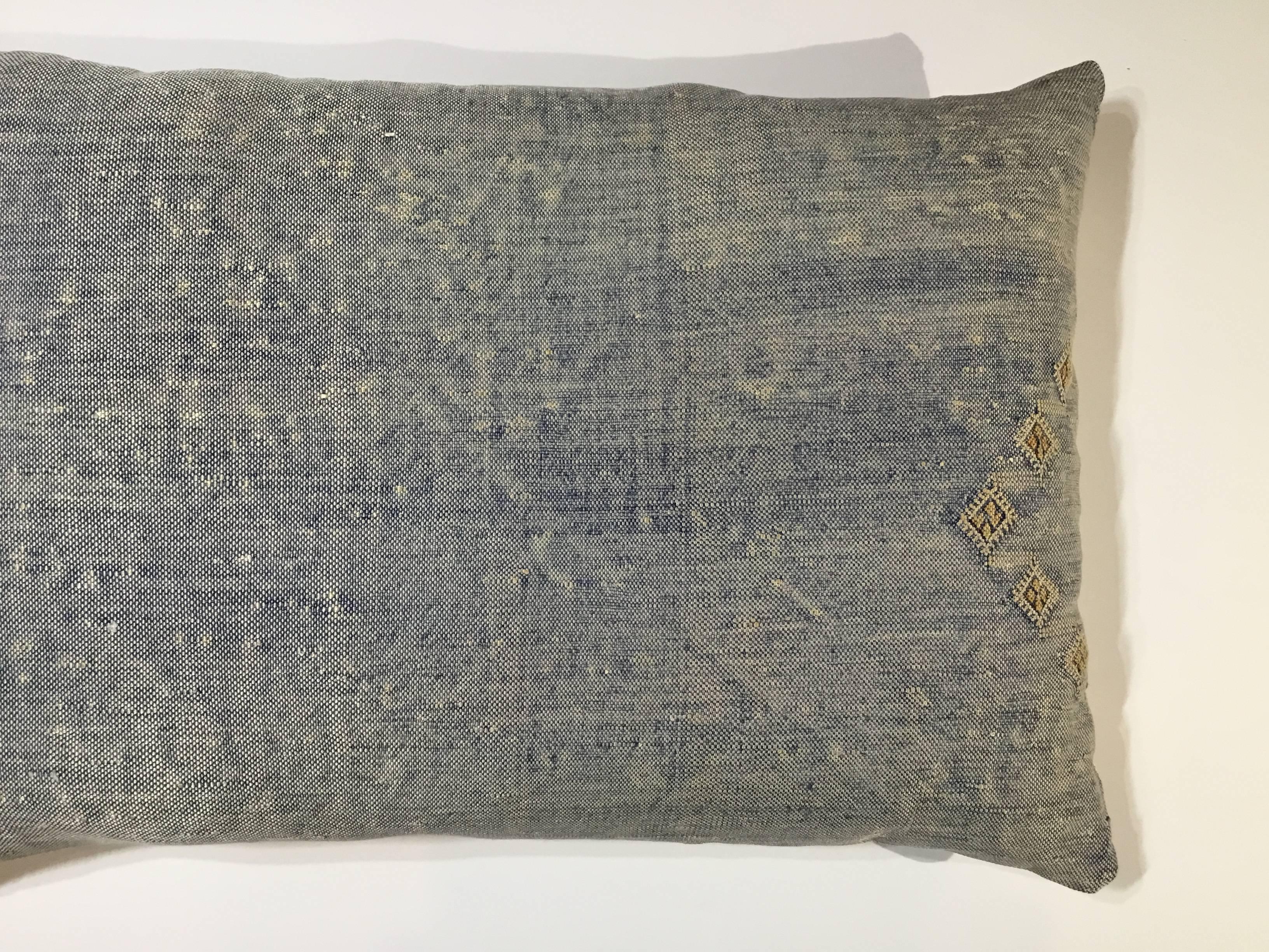 Beautiful pillow made of flat-weave rug fragment, light indigo color with geometric motifs, fresh insert, silk backing.