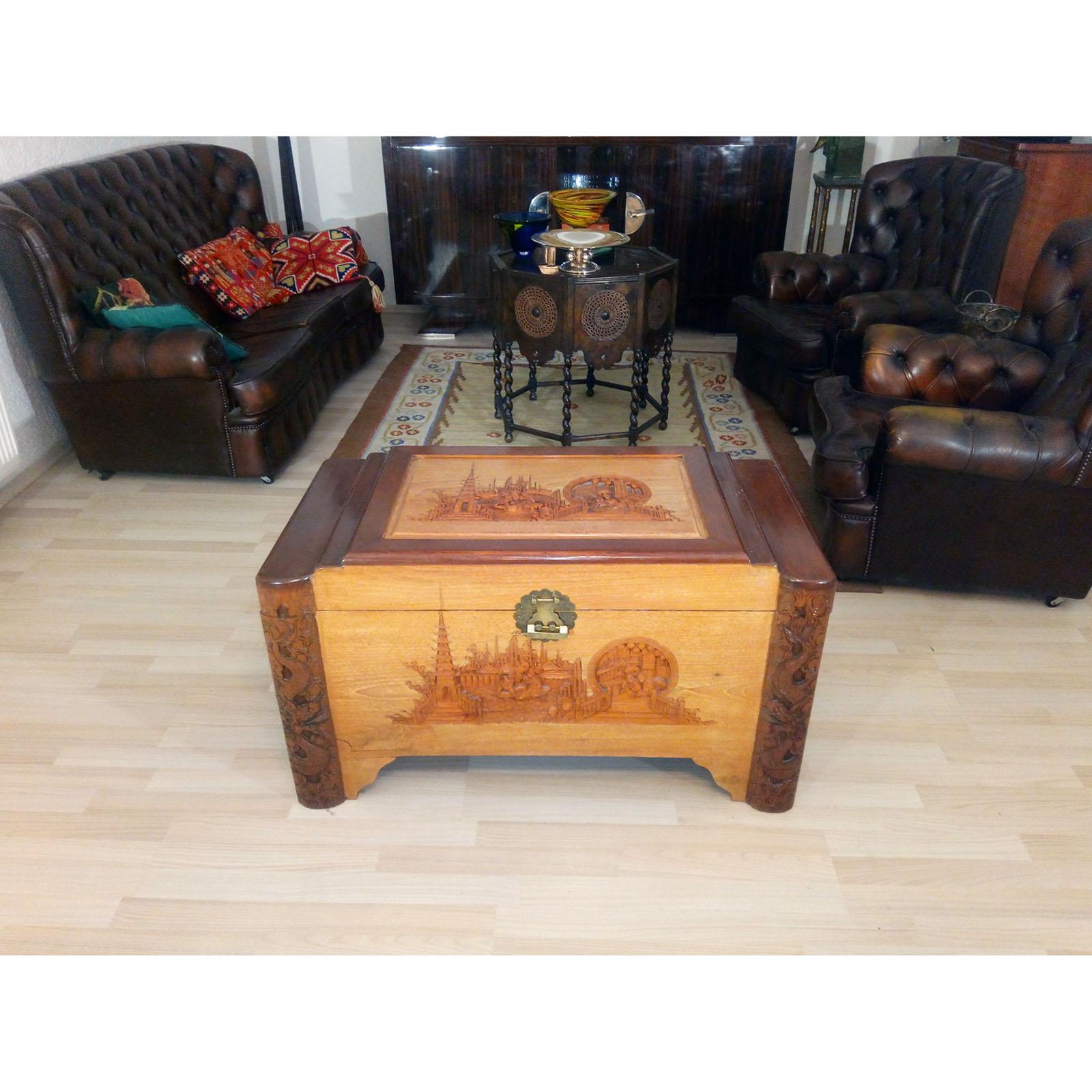 Mid-20th-century oriental camphor wood chest or trunk. Elaborate shapes, different sorts of wood, and detailed carved scenes. It retains the original brass clasp and lock. Chinese inscription inside.
It is in very good original condition, with some