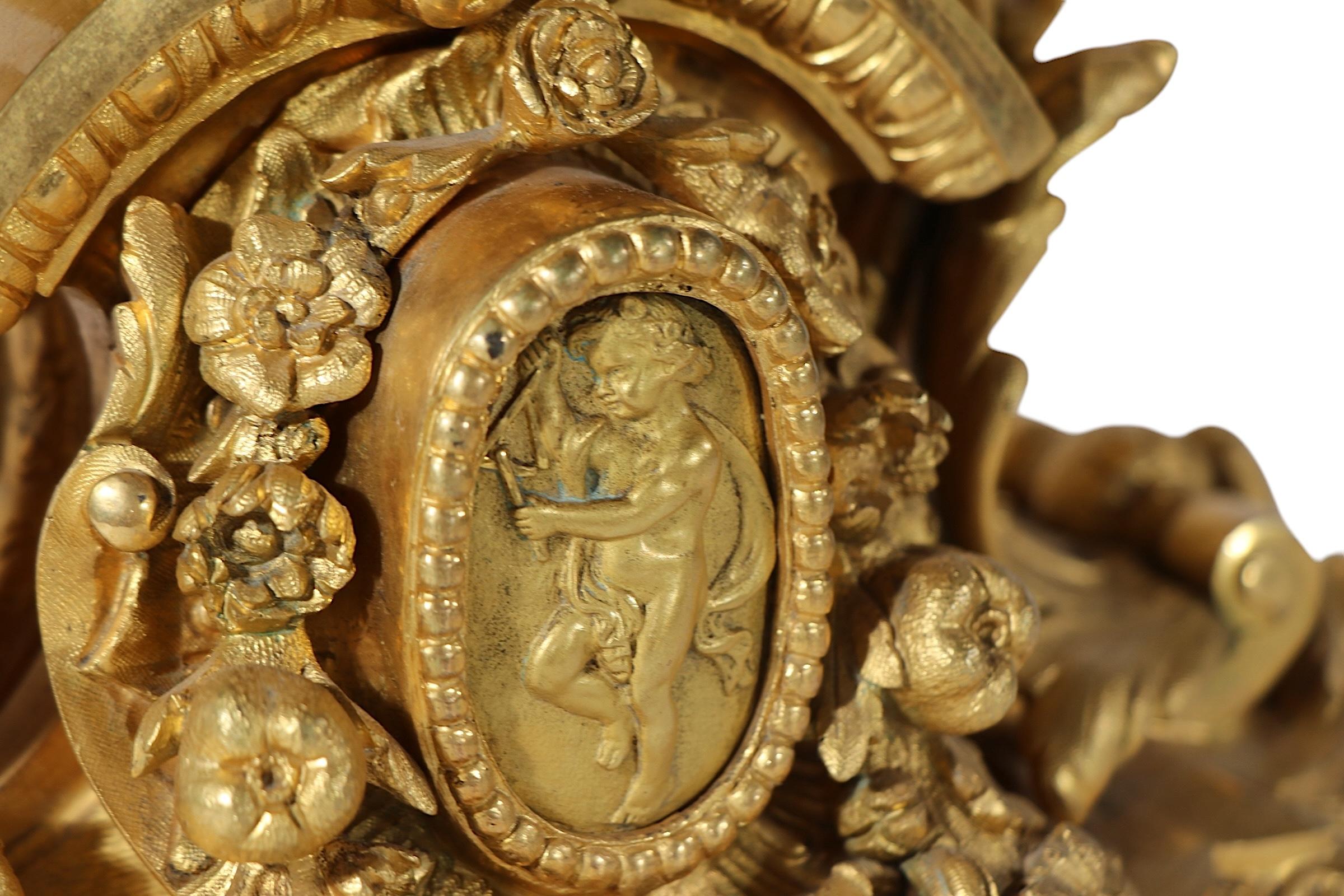 Incredible ornate French brass candelabra  table lamp, circa 19th C. The lamp was originally a candlestick, and was part of a three piece garniture set, it was later converted to use as an electric table lamp. This example is in very good, clean,