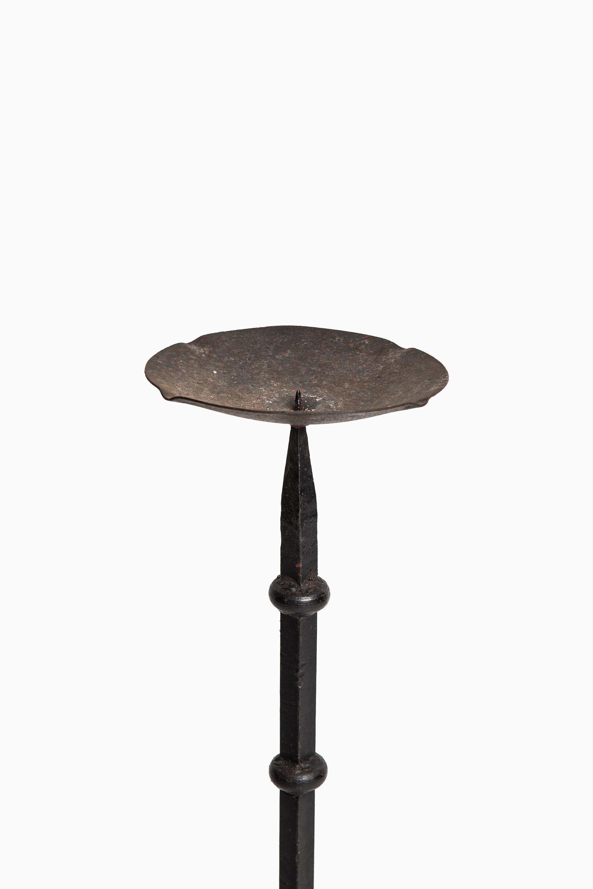 Rare large candlestick in wrought iron. Produced in Sweden.