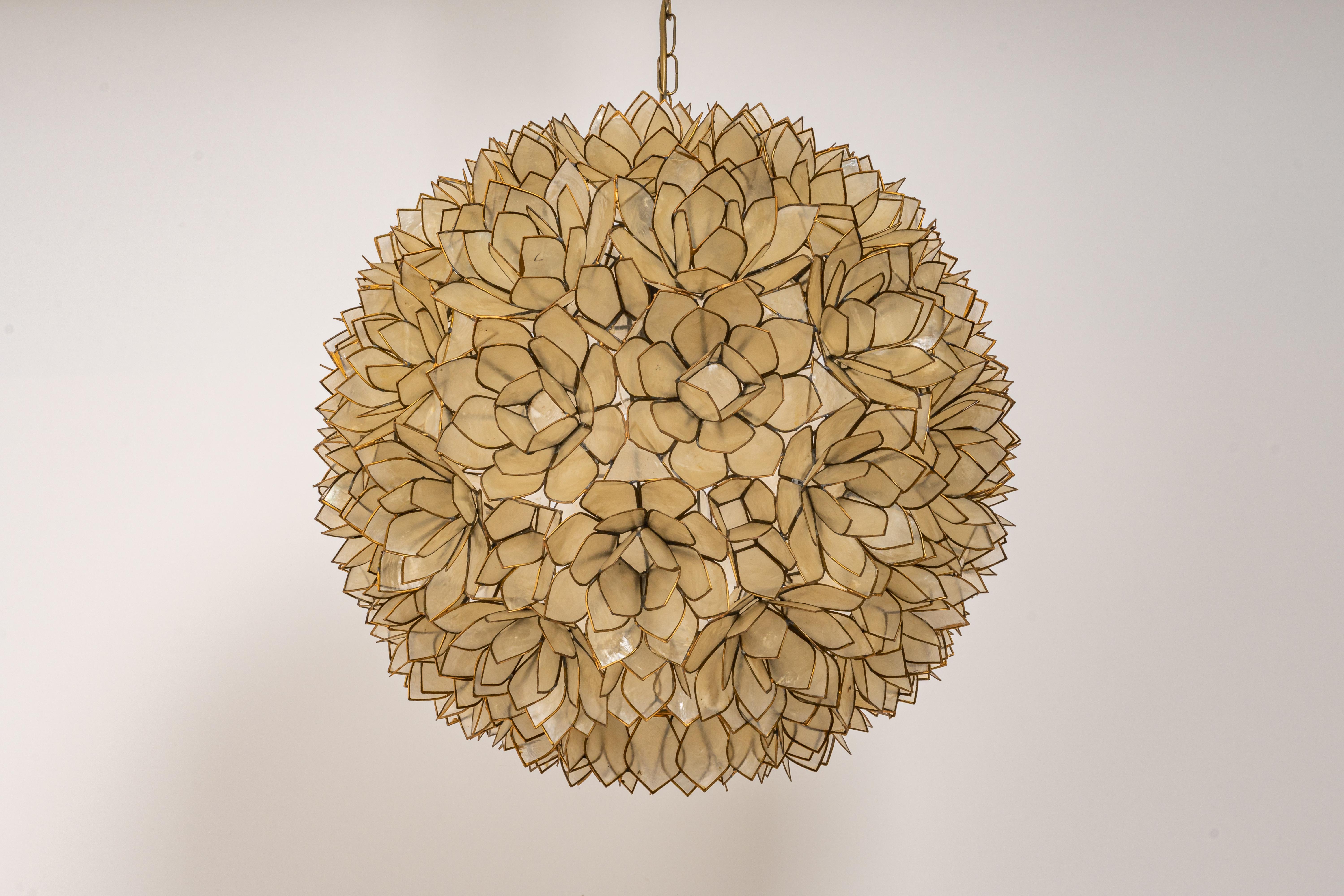 Stunning capiz shell Lotus ball chandelier pendant light Germany, 1960s

It requires 1 x E27 standard bulbs with 100W max each.
A light bulb is not included. It is possible to install this fixture in all countries (US, UK, Europe, Asia,