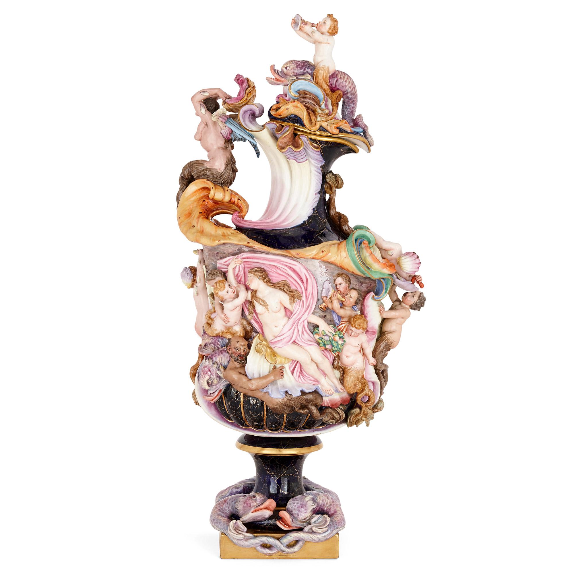 Large Capodimonte porcelain ewer and cover
Italian, circa 1880
Measures: Height 75cm, width 36cm, depth 27cm

Made in Italy towards the end of the 19th century, this large and rare ewer is finely decorated with dolphins, shells and mythological