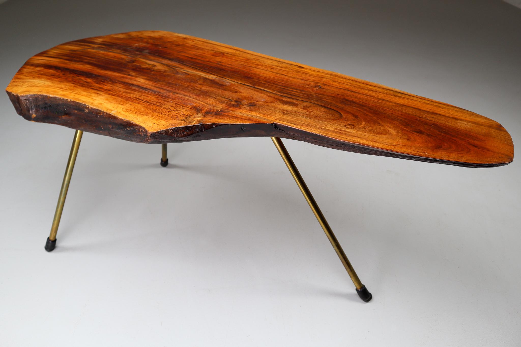 A large walnut tree trunk coffee table by Austrian designer Carl Auböck II (often simply referred to as Carl Auböck), from circa 1950s. A large tree trunk table designed and made by the Auböck Werkstätte, circa 1950s. The modernist table is made of