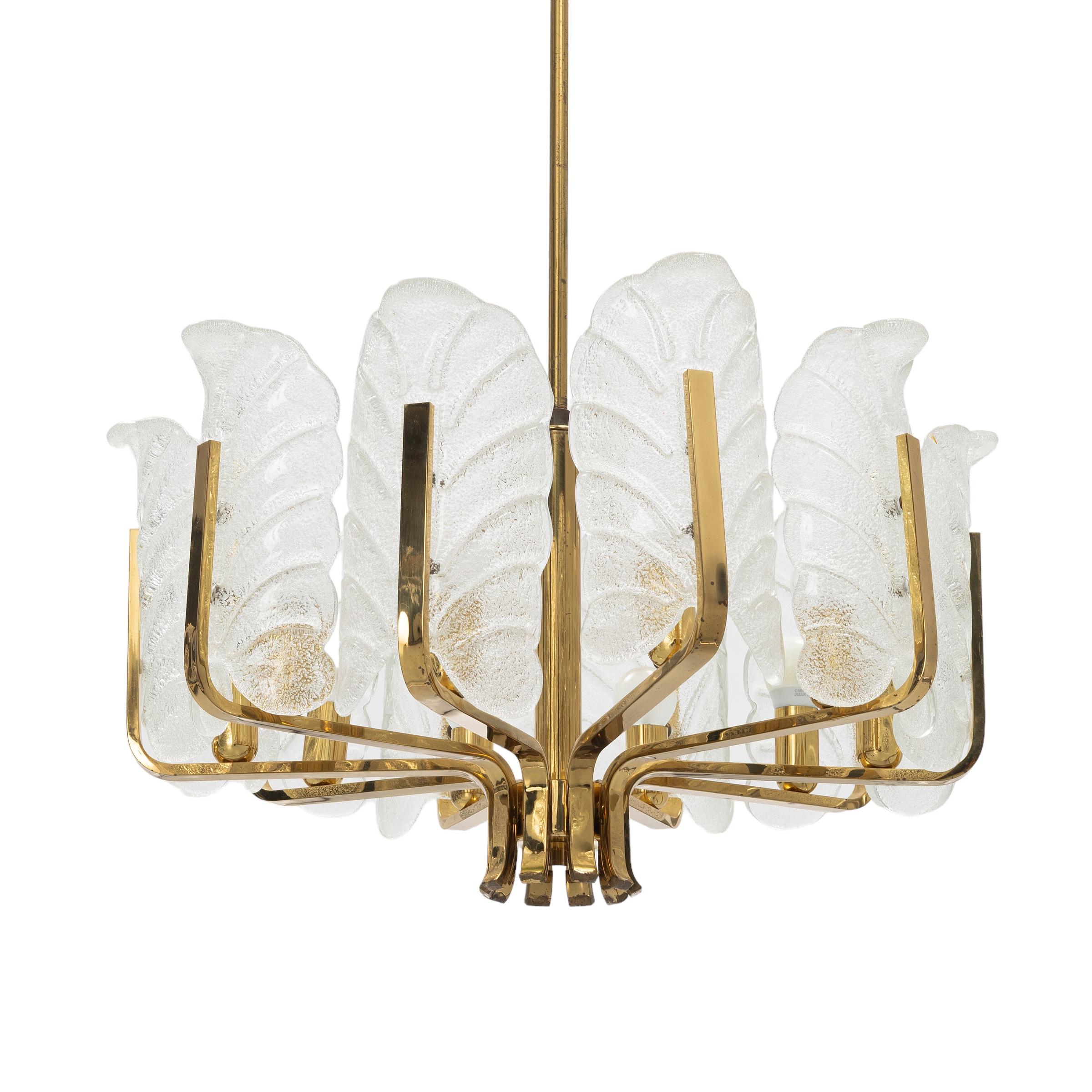Very beautiful ceiling lamp in brass with decorative leaves of Murano glass. The lamp was designed by Carl Fagerlund for orrefors in the 60s.