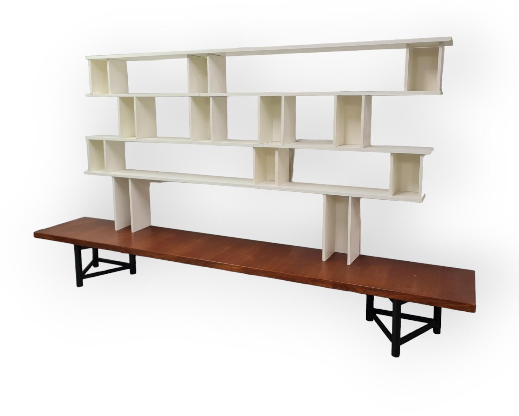 Hiort af Ornäs designed this type shelf in the 1950s. It is called the `Välipala hylly` in Finnish, and it has become a classic a long time ago. Actually, it has been taken again into production just recently. 

This is a very simple, practical and