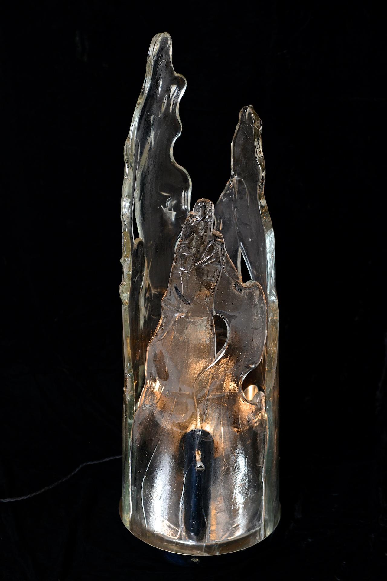 Sculptural glass light. Looks like melting ice! Italy circa 1970 by the glass lighting designer Carlo Nason.

Three separate bulb holders inside glass 

Can be used as a table or floor lamp.