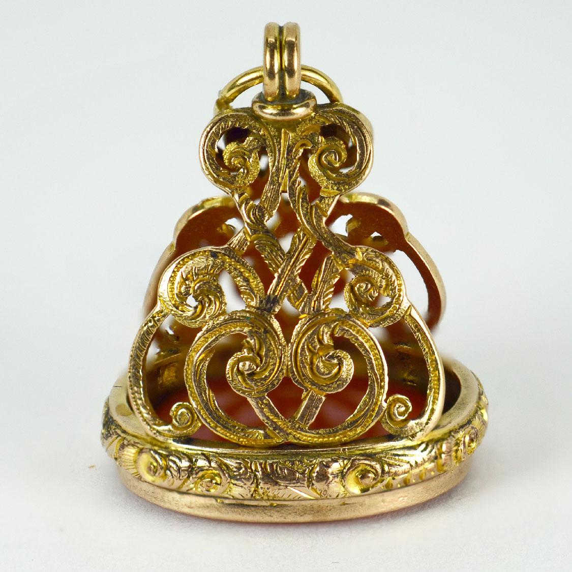 A large yellow gold charm pendant designed as a blank carnelian fob. Hallmarked for 9 karat gold, Birmingham, 1898.

Dimensions: 3.5 x 2.8 x 2.4 cm (not including jump ring)
Weight: 12.27 grams 

