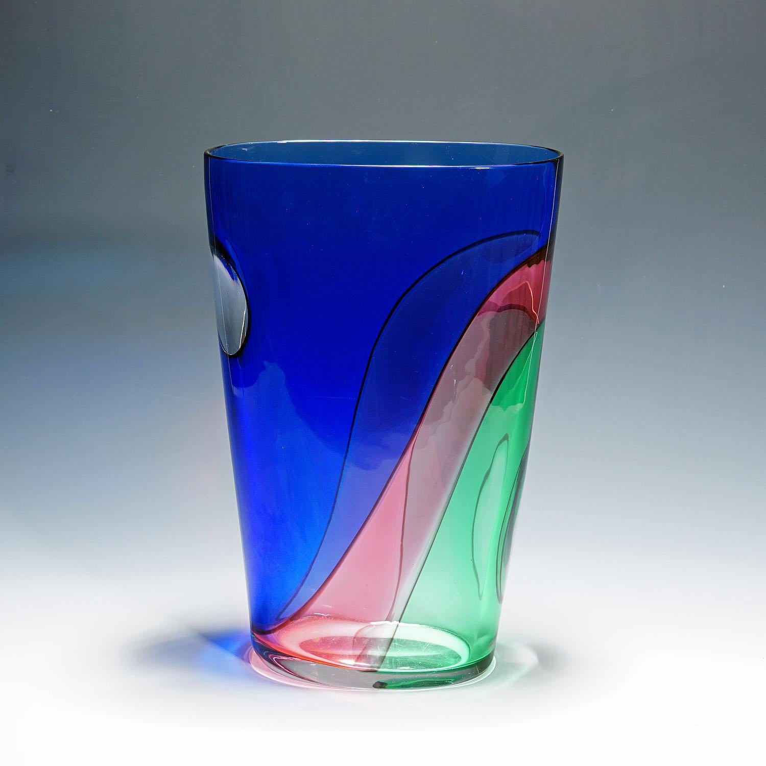 Large Carnevale Vase by Vetreria Archimede Seguso ca. 1980s

A very large vintage art glass vase of the Carnevale series introduced by Archimede Seguso in 1987. Manufactured by Vetreria Archimede Seguso. Clear glass with overlapping blue, green and