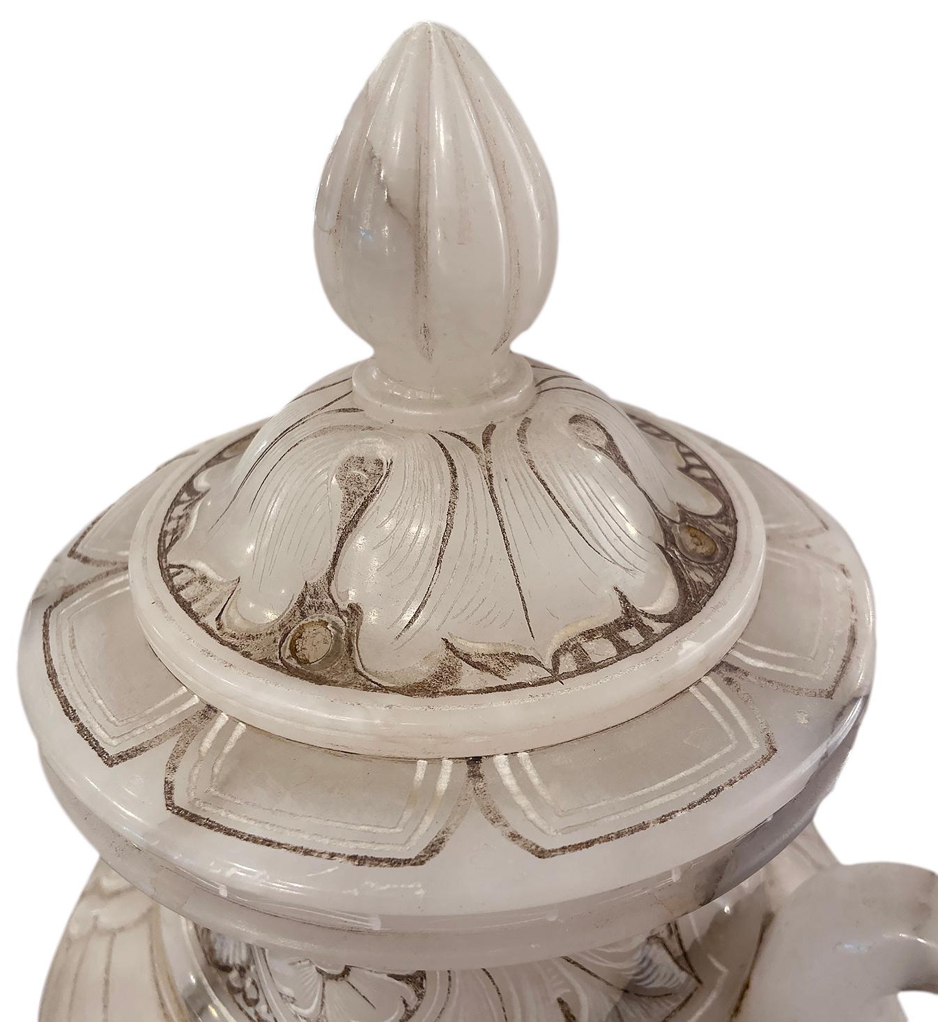 A circa 1920's French carved alabaster urn-shaped lamp with interior light.

Measurements:
Height: 21.25
